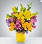 Sunday Afternoon by BloomNation™ - This arrangement is a sweet surprise for any recipient. Featuring a selection of yellow and purple flowers in a yellow vase, this arrangement is springtime in flower form and a great gift for Easter or Passover.  Approximate Dimensions: 13&quot;D x 16&quot;H