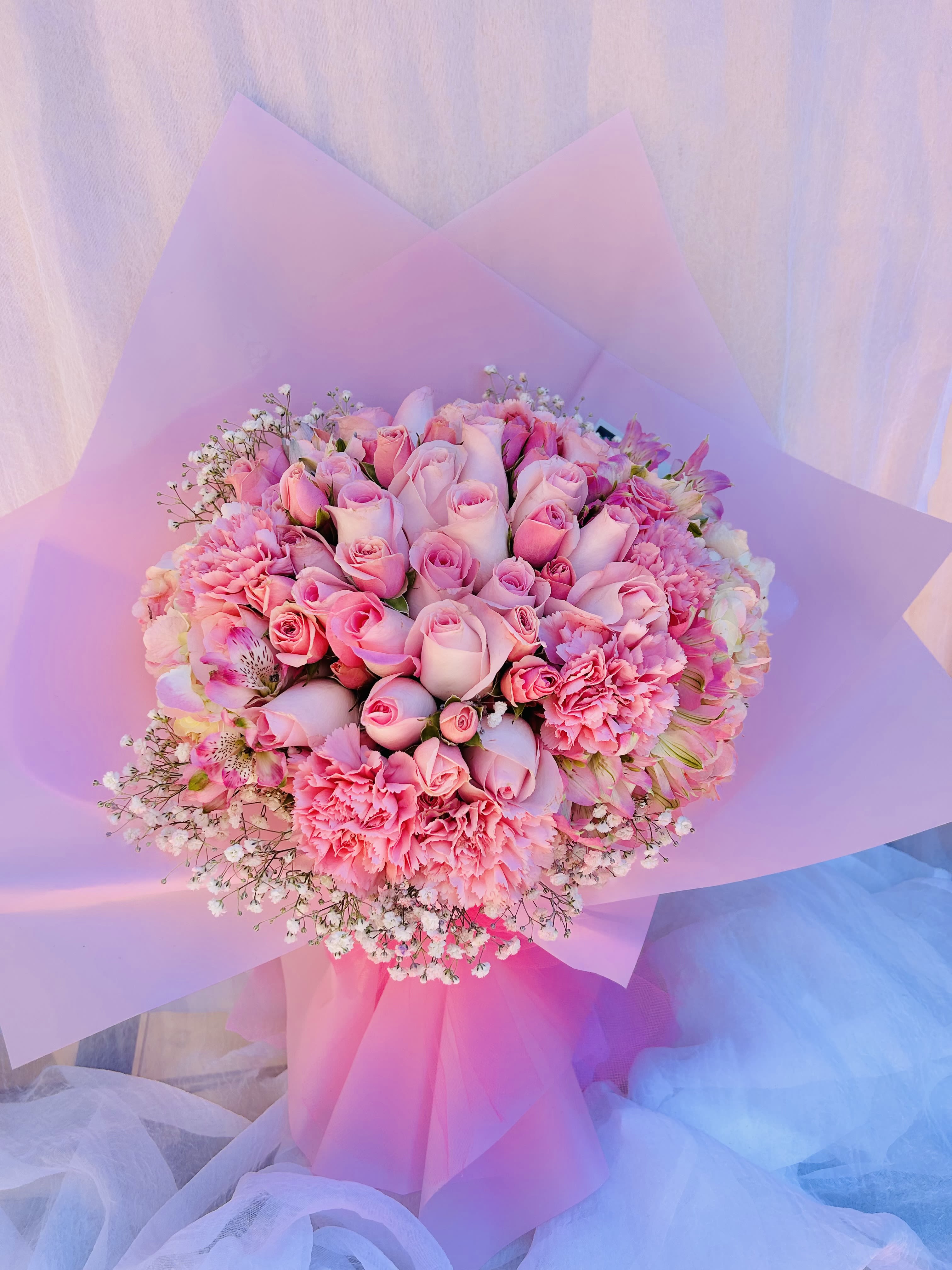 Love in Blooms - Beautiful pink bouquet featuring pink roses, pink tulips, and alstroemeria
