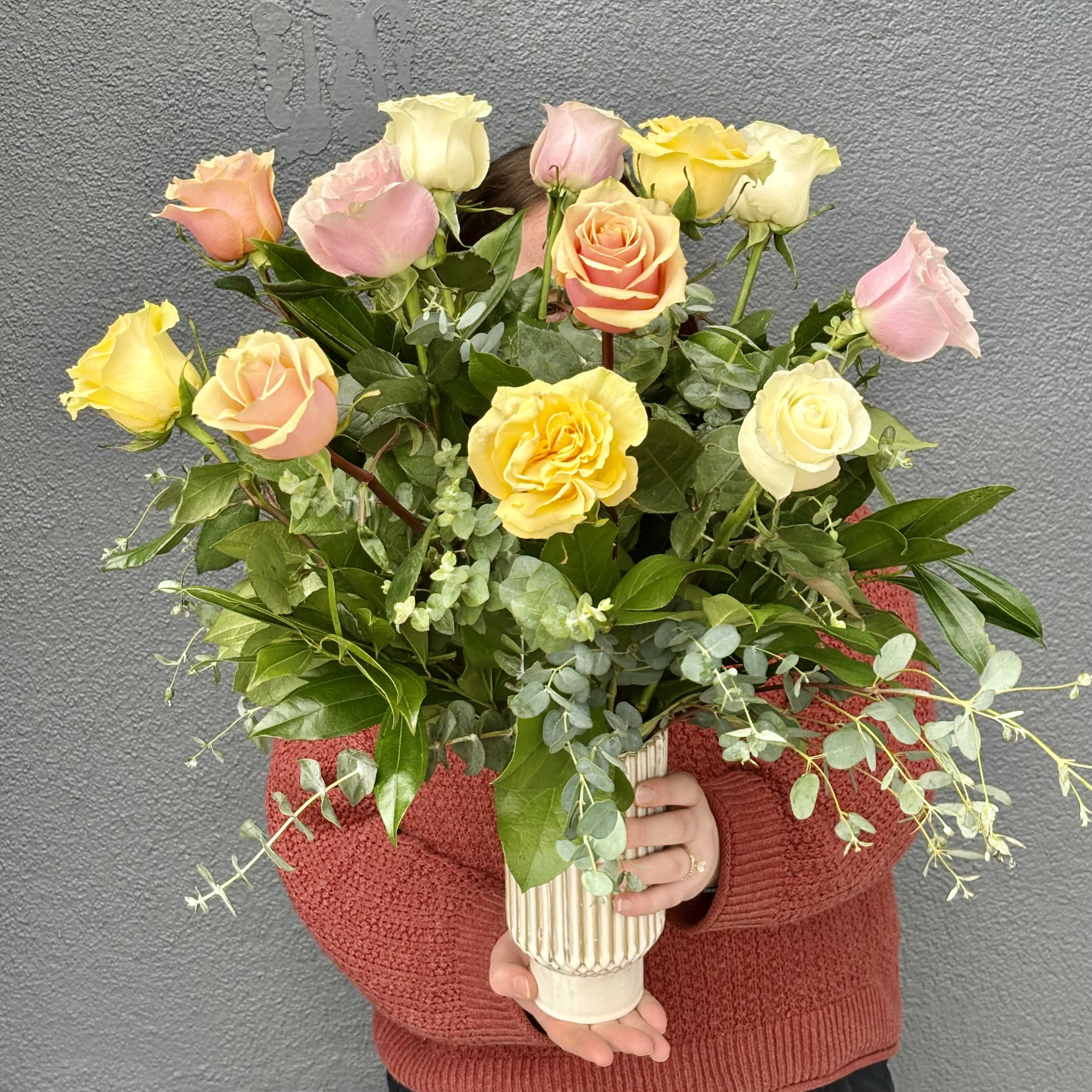 Pastel Spring Roses - This arrangement showcases a soft and muted collection of South American roses. Light Pink, Pale Yellow, and Peach are an excellent combination of roses to celebrate the coming of spring. Spring is all about new beginnings and transformations as well as rejuvenation and the anticipation of nicer weather. This arrangement is perfect to celebrate a birthday, new baby, graduation, and retirement as they are all occasions that represent a new start on life. 