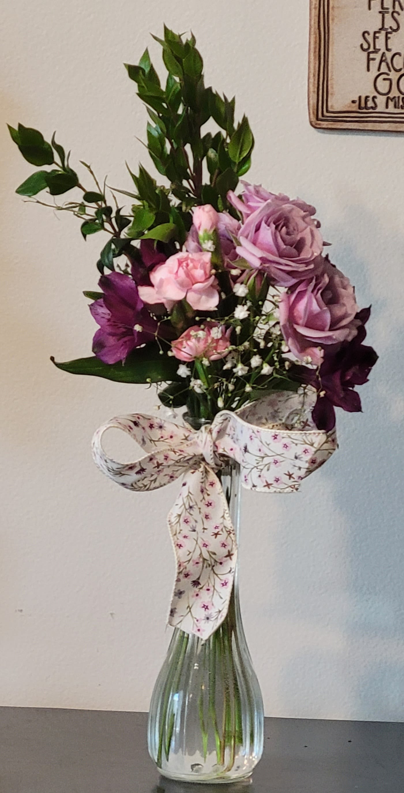 Flower power by Dixie's Flowers Flower power by Dixie's Flowers - A set of purple and pink roses with purple delights will help bring a smile on the faces of those that you love. Let the flower power work for all occasions.