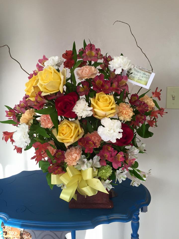 Rose and Carnation Basket - This sweet basket is a perfect combination of roses, carnations and alstroemerias. A Great way to express your sympathies, or to brighten someone's day.