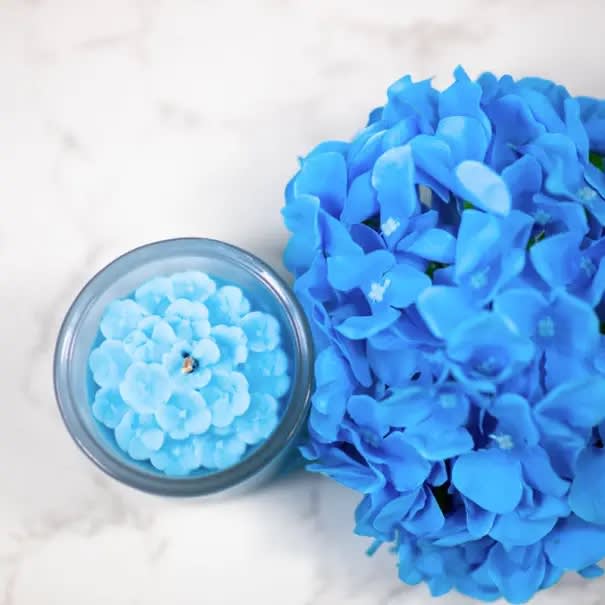 Hydrangea Flower Candle, 2.5 ounces - Multifaceted™ Artisan Candles Our hydrangea is one of our all time favorite flowers. We captured this beauty with a gorgeous candle represents gratitude, grace and beauty.  Scent: lush, green and exotic, the hydrangea fragrance is a clean scent reminiscent of Japanese gardens with green florals &amp; herbal notes