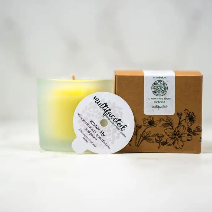 Water Lily Flower Candle, Eco -Friendly Candle - 2.5oz - Multifaceted™ Artisan Candles Our water lily scent candle represents rebirth, good fortune, &amp; peace. The large blooms of this water lily are the perfect hue of yellow that are sure to bring lots of attention.  Scent: water lily is a blend of black currant, absinthe, pomegranate, cider, mango and coconut 