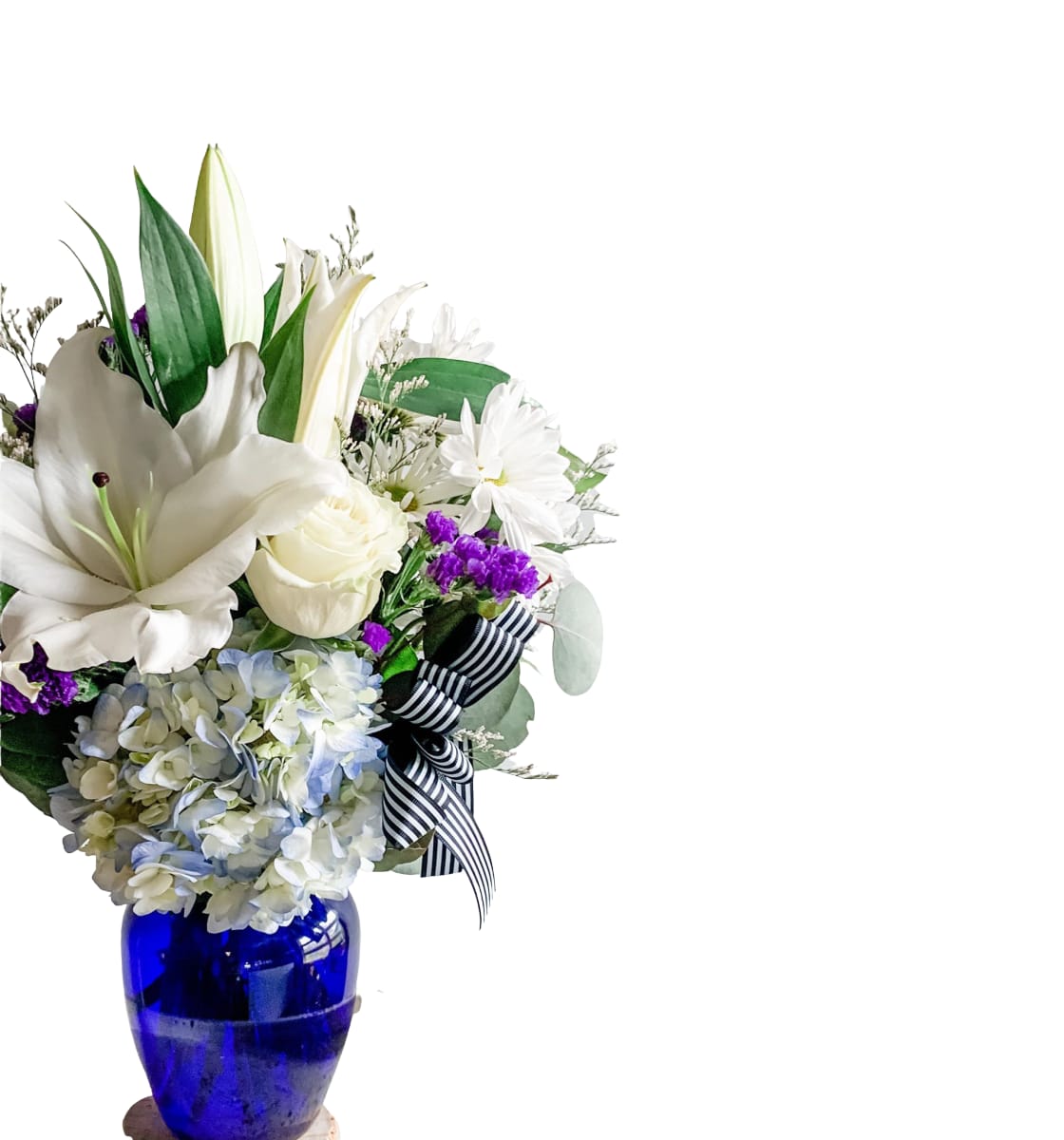 Blue Moon Blue Moon - This arrangement is filled with lilies, hydrangea, roses, and more! Vase style may vary.