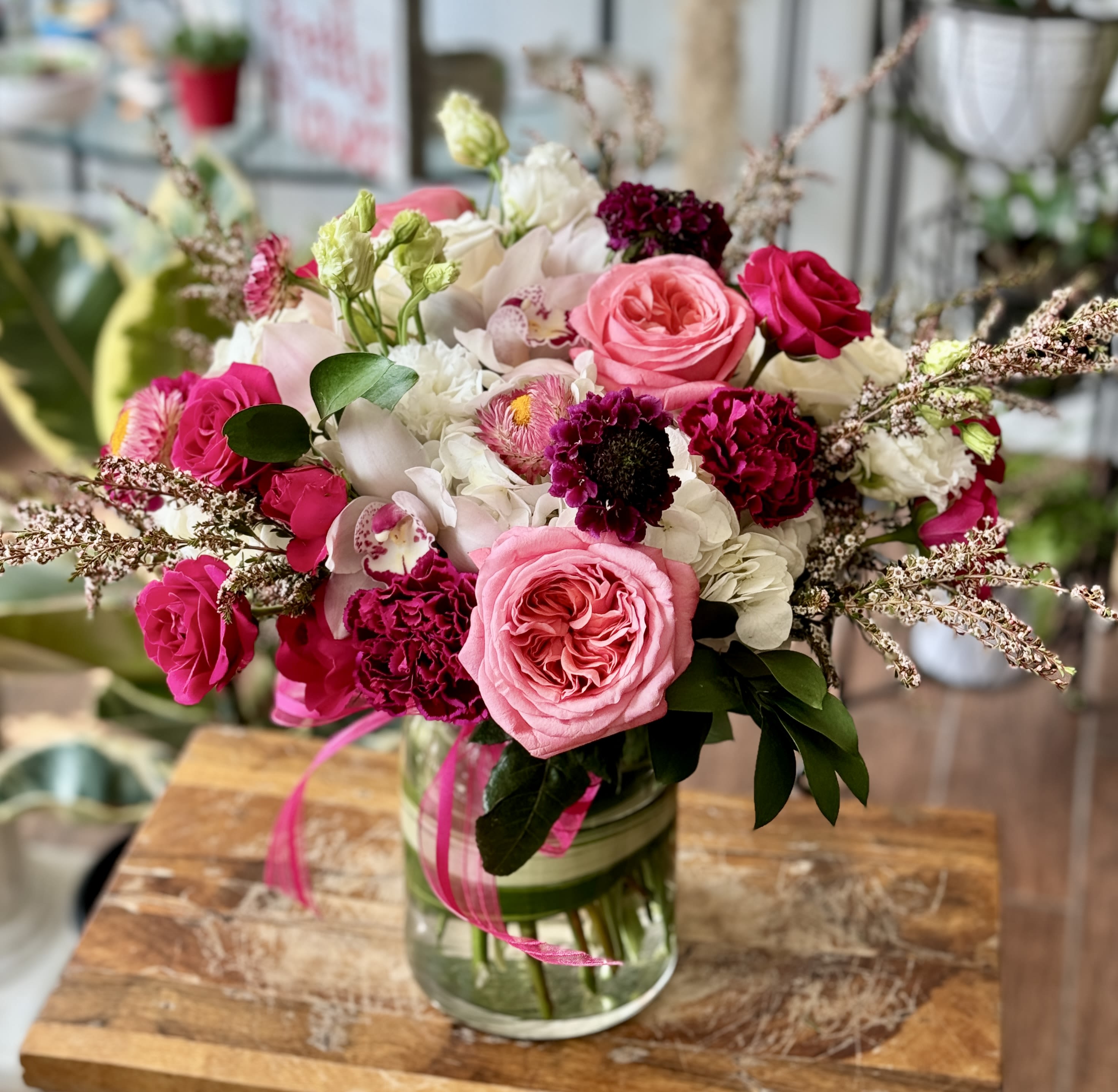 Juliet - Romantic variety of fresh flowers arranged in a clear glass vase. 