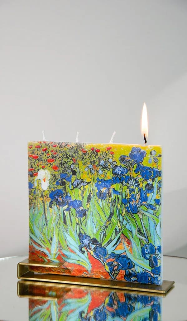 Irises Flatyz Candle Irises Flatyz Candle - Unleash the magic as this extraordinary candle burns, revealing its distinctive shape. Each candle is meticulously crafted to be burned one wick at a time, ensuring a truly mesmerizing experience. With drip-resistant qualities when burning a single wick, you can enjoy a worry-free environment. Embrace the extended glow of each wick, offering an impressive burn time of 4 hours. Our hand-crafted candles are thoughtfully designed to be drip-resistant, smokeless, self-extinguishing, and scentless, delivering a pristine and clean burn. Enhancing the elegance of these remarkable candles, each one is accompanied by a high-end, modern gold steel base, elevating your decor with a touch of sophistication.