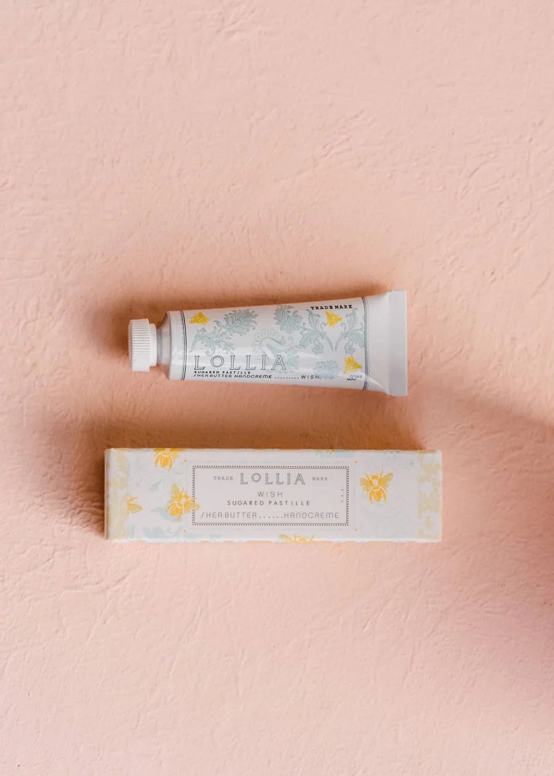 Wish Shea Butter Handcreme - Perfectly petite, this lush hand cream is rich with beneficial hydrating extracts of Aloe &amp; Shea Butter to lightly moisturize as Macadamia Nut &amp; Avocado Oils comfort &amp; soothe skin. Delicate infusions of Sugar Cane, Vanilla Bean &amp; Jasmine meet sheer Amber Woods &amp; Ylang Ylang to leave skin deliciously fresh.