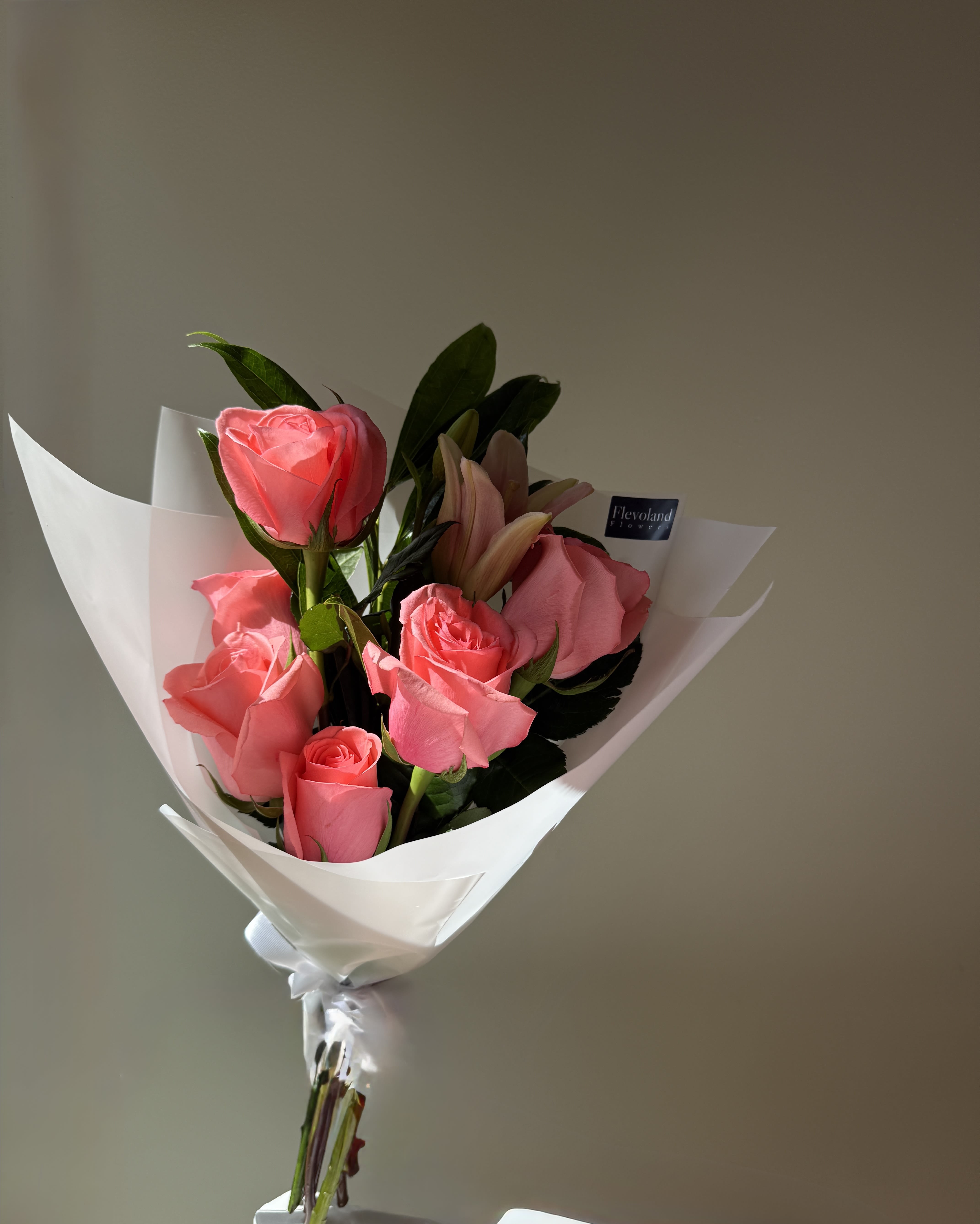 July Promo - A fresh, charming option at an accessible price.  Includes 6 roses in the color of the day, beautifully wrapped and ready to gift or enjoy. Perfect for brightening someone’s day — no special occasion needed.   Available only during the month of July. Same-day delivery subject to availability.  Because flowers don’t need a reason.