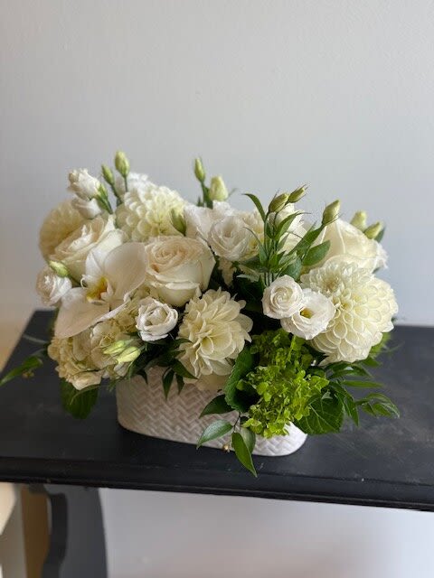 Summer 21 - Flower arrangement with white lisianthus, green hydrangea, White orchid, and some greeneries.  Depending on availability, flowers may change