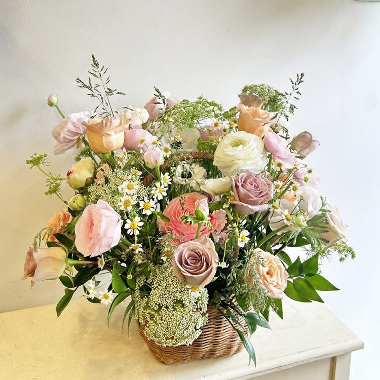 Summer 41 Summer 41 - A basket arrangement with summer flowers. Due to the availability of certain flowers and vases, substitutions might occasionally be necessary to assemble your arrangement.