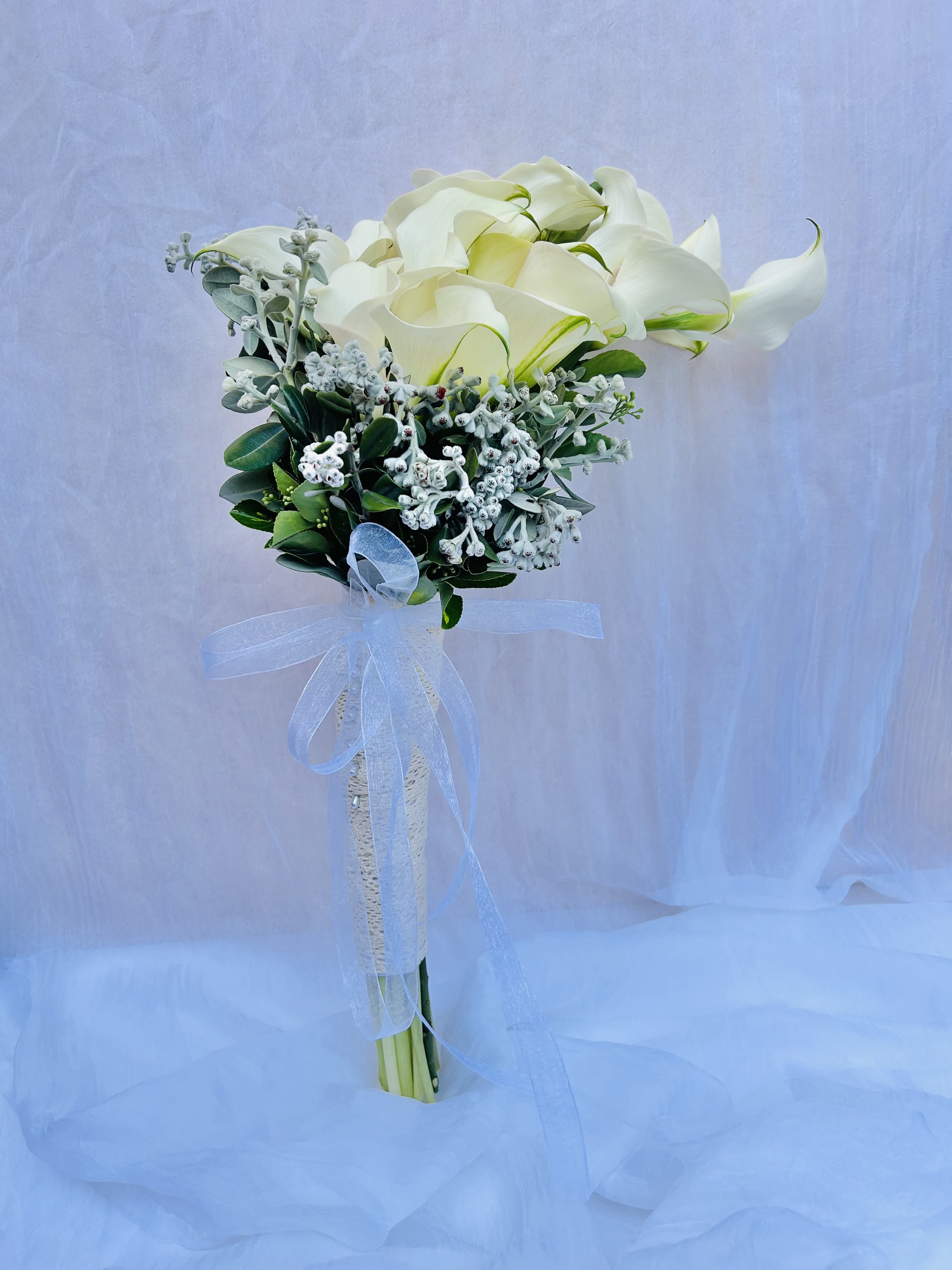 Classic Calla Lily  - Beautiful bouquet featuring white calla lillies and white green accents.