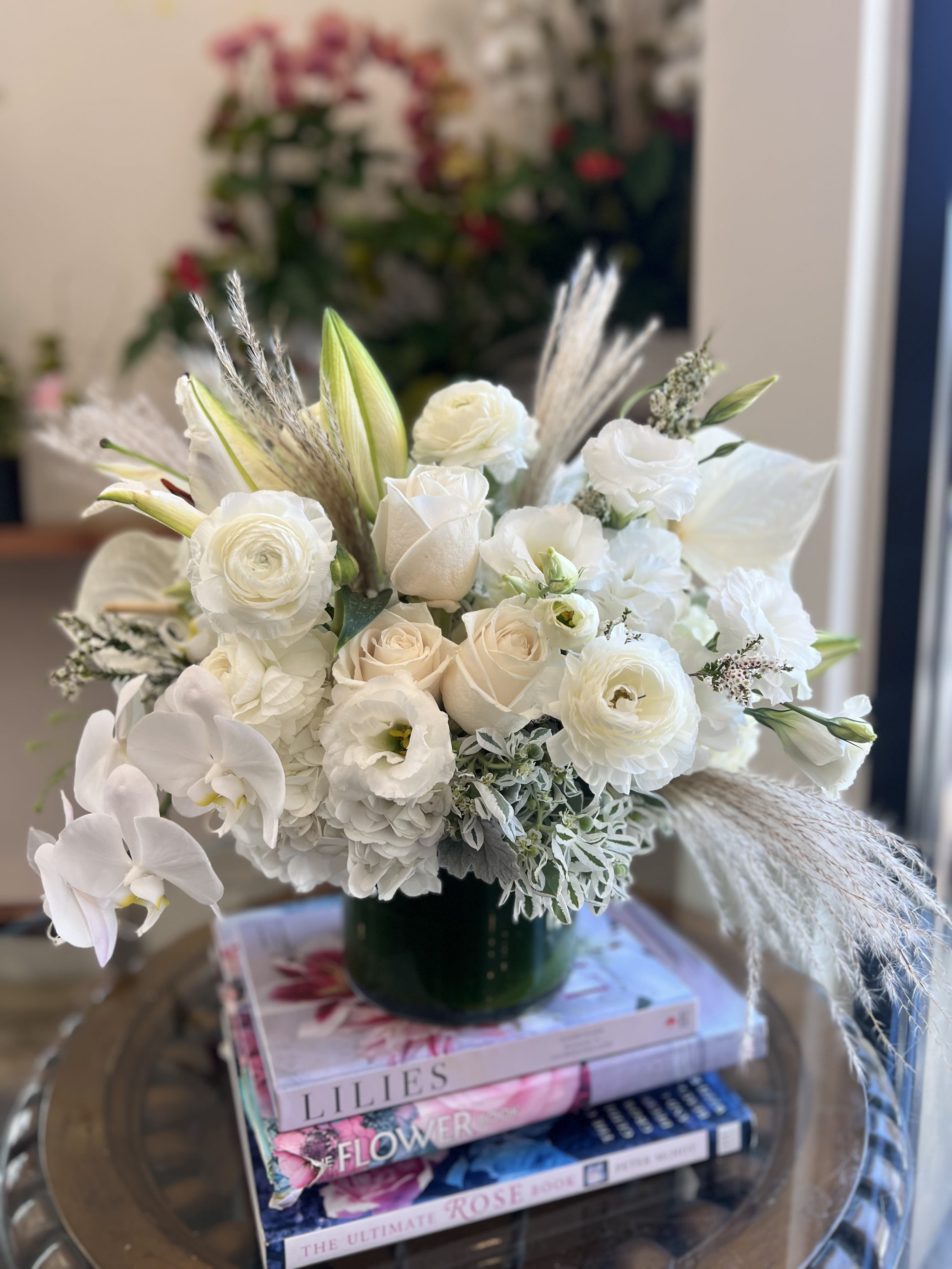 White Boho White Boho - Elevate your space with the timeless elegance of our "White Boho" floral arrangement. Florals include, white hydrangea, white anthuriums, white lisianthus, white roses, white ranunculus, white lilies, and California grown pampas grass.