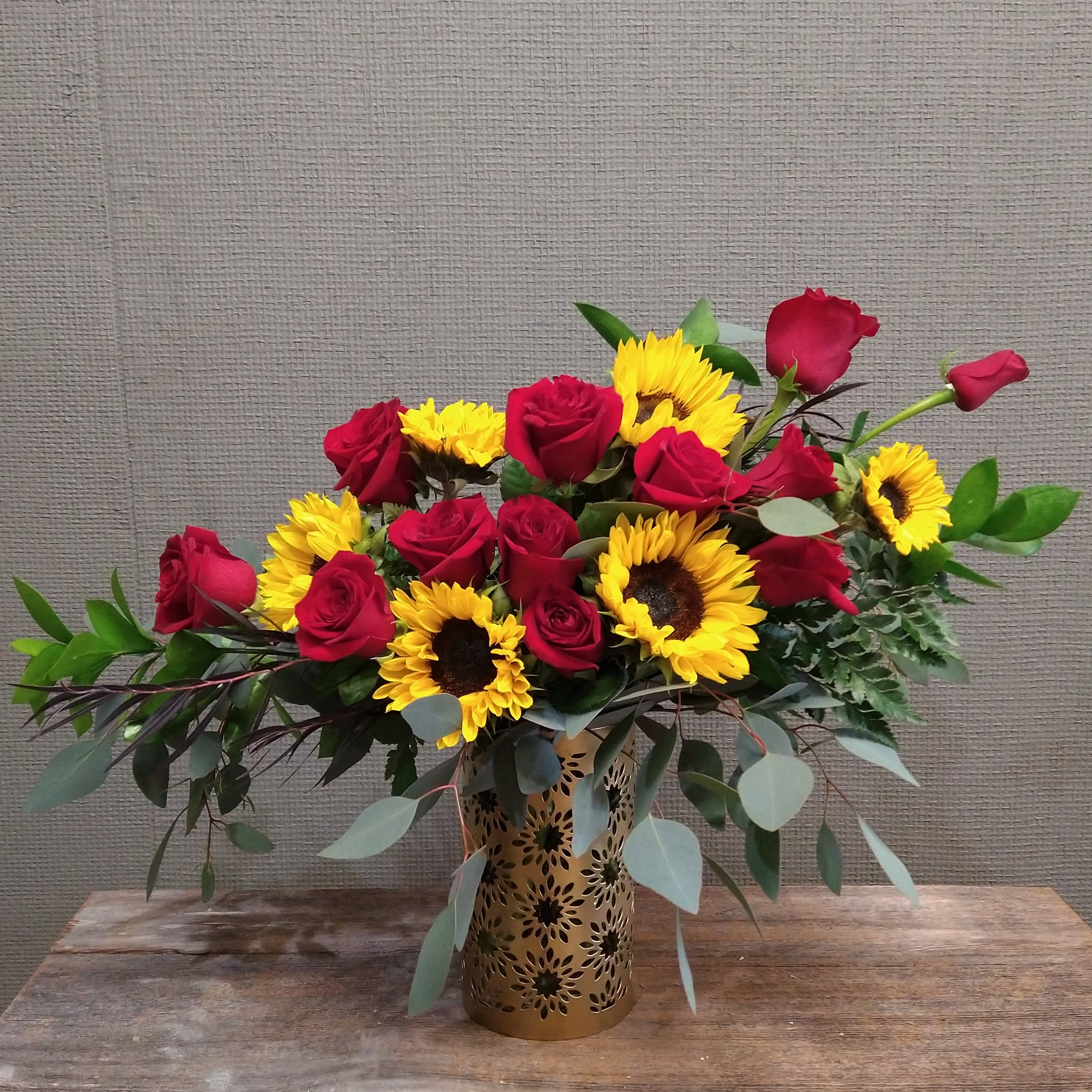 You are My Sunshine You are My Sunshine - One dozen red roses and six sunflowers in a stunning line. Sent in a keepsake sunflower vase.