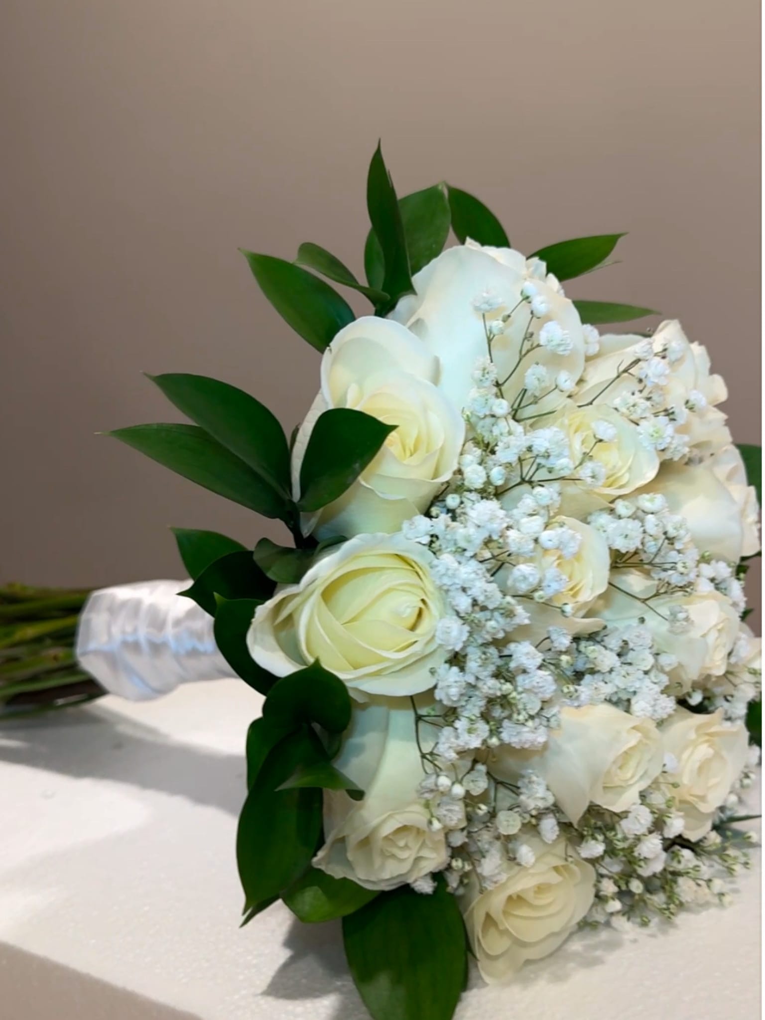 Bliss Bridal  - Whether you're walking down the aisle or gifting a bride-to-be, this bouquet has inspired countless love stories. Its serene palette and gentle fragrance evoke feelings of peace, grace, and sincere devotion—making it the perfect choice for the modern romantic.