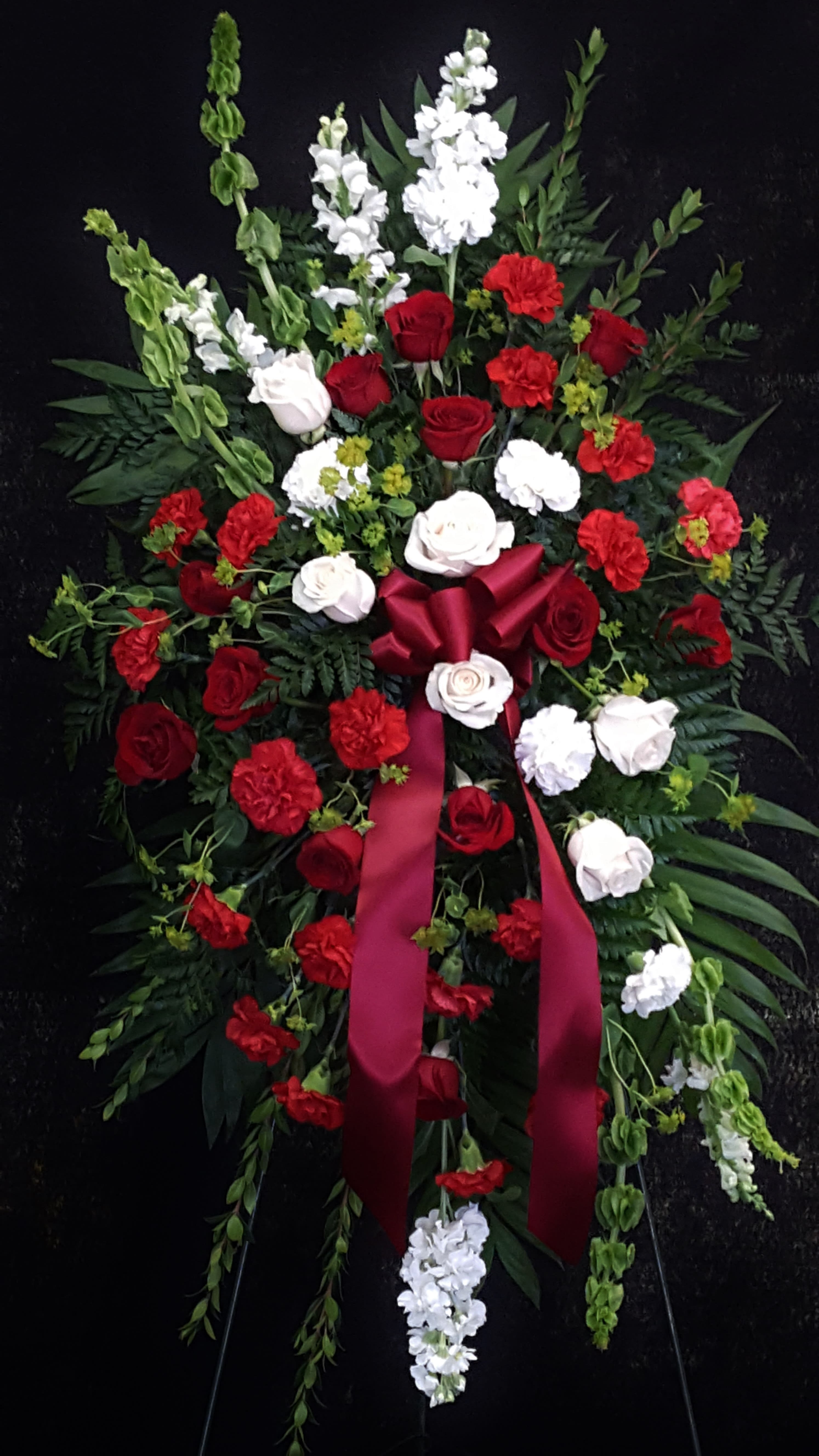 Red Magnificence Spray - a spray of roses and carnations in shades of red and white