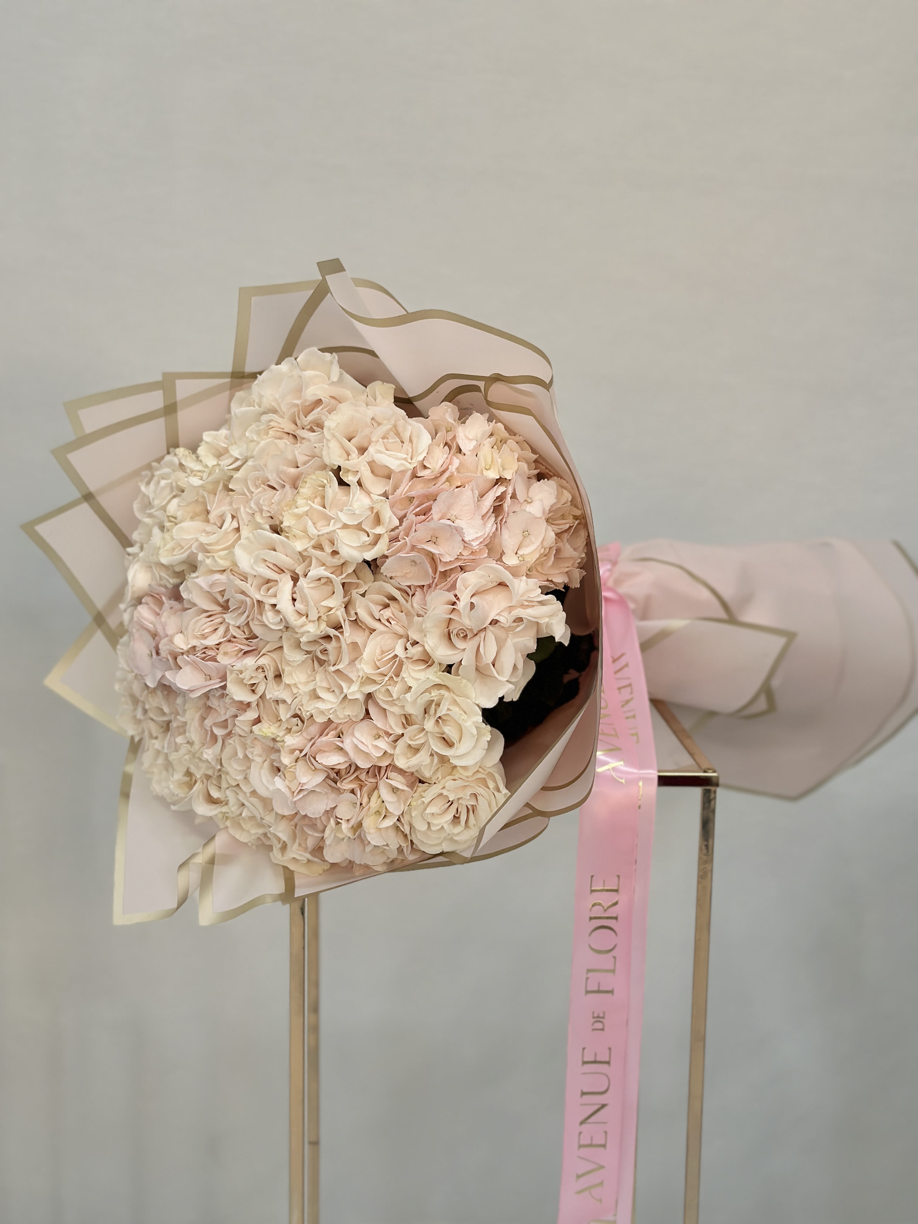 Fluffy Garden Bouquet - Featuring lush garden roses nestled among fluffy hydrangeas, this bouquet is a dreamy blend of soft textures and romantic blooms.  Perfect for any occasion where you want to make a lasting impression. 