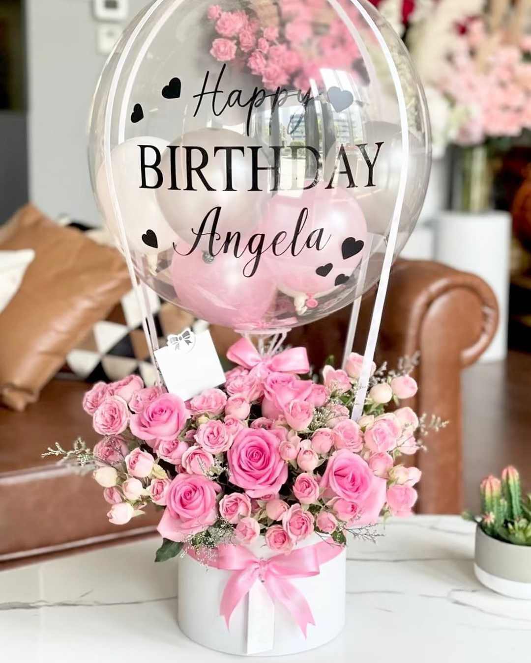 Happy Birthday Hot Air Balloon Flowers - Make their special day unforgettable with this beautiful Happy Birthday Arrangement, featuring a delightful mix of roses. Topping it all off are  birthday balloons that make this gift truly stand out. Celebrate the joy of another year with a beautiful floral surprise that they'll cherish! Order now and let the festivities begin!   