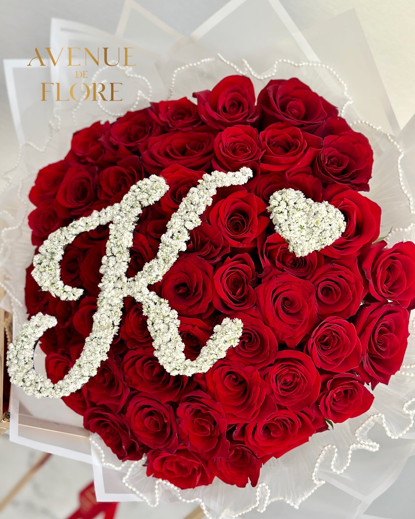Initial Bouquet - Let your heart speak with a personalized red rose bouquet featuring a special initial. A beautiful symbol of love, wrapped in romance and meaning—because your love story deserves to be written in petals 