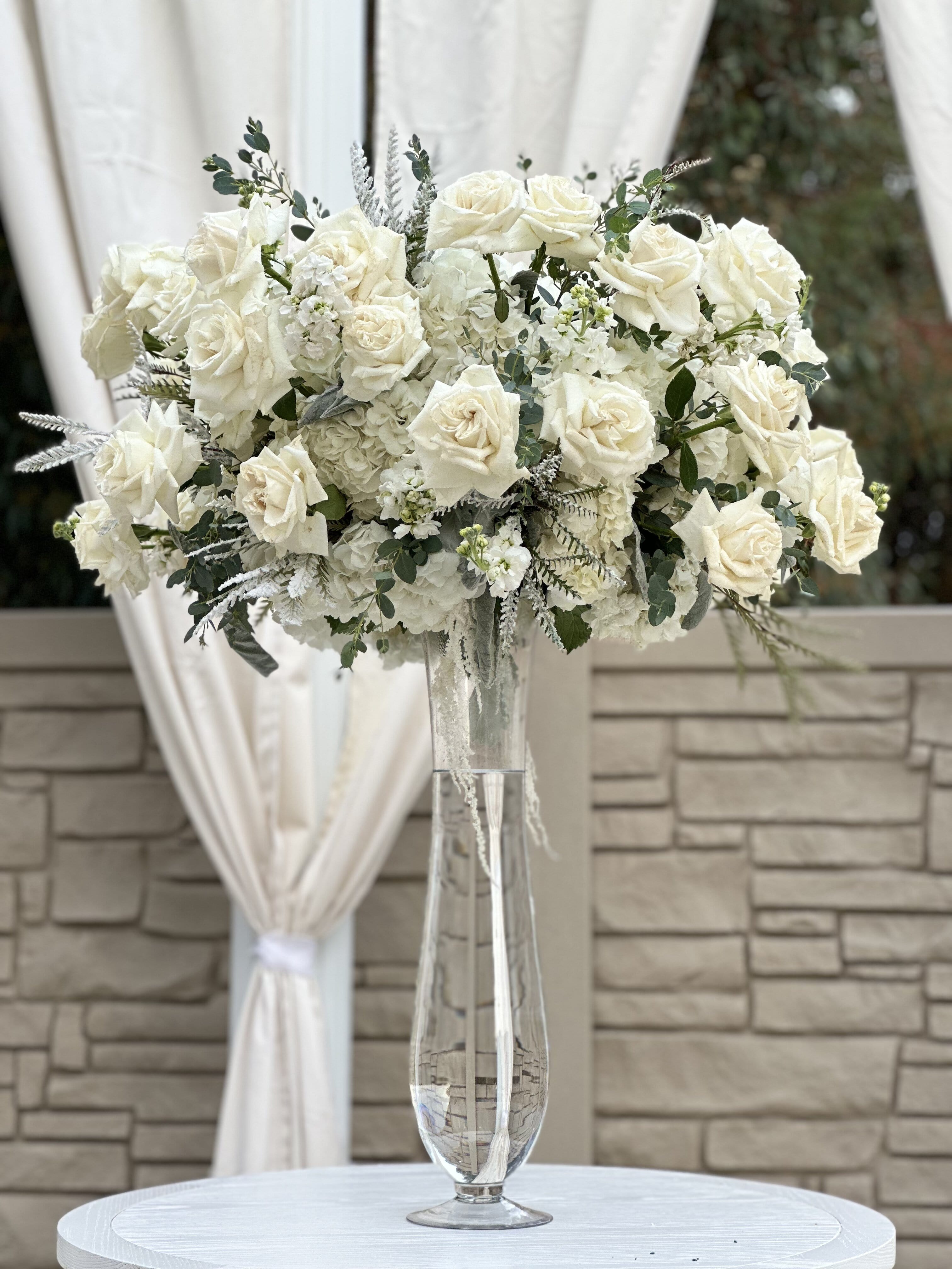 Lasting Impression Lasting Impression - Introducing a timeless vase arrangement that exudes elegance and grace: a stunning blend of pristine white roses and delicate hydrangeas, meticulously arranged to captivate the senses and uplift the spirit. Whether offered as a thoughtful gift or showcased as a breathtaking centerpiece, this arrangement is sure to leave a lasting impression.