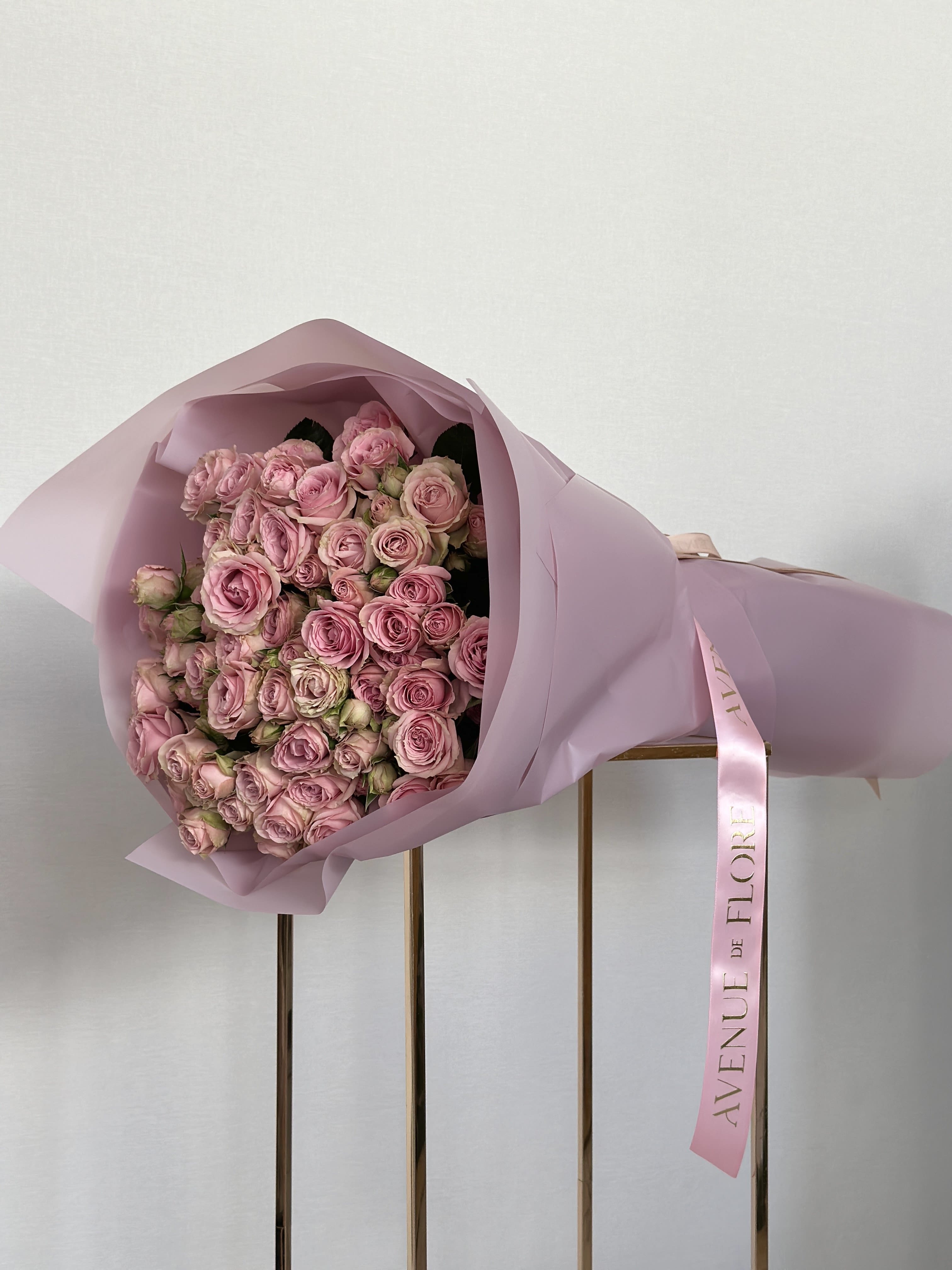 Lavender Baby Rose Bouquet - This beautiful lavender spray rose bouquet is the perfect mix of elegance and charm. With soft, pastel blooms and a gentle fragrance, it’s a lovely way to brighten any space or occasion. Whether it’s for a special celebration or just to add a little beauty to your day, this bouquet is sure to make a lasting impression.