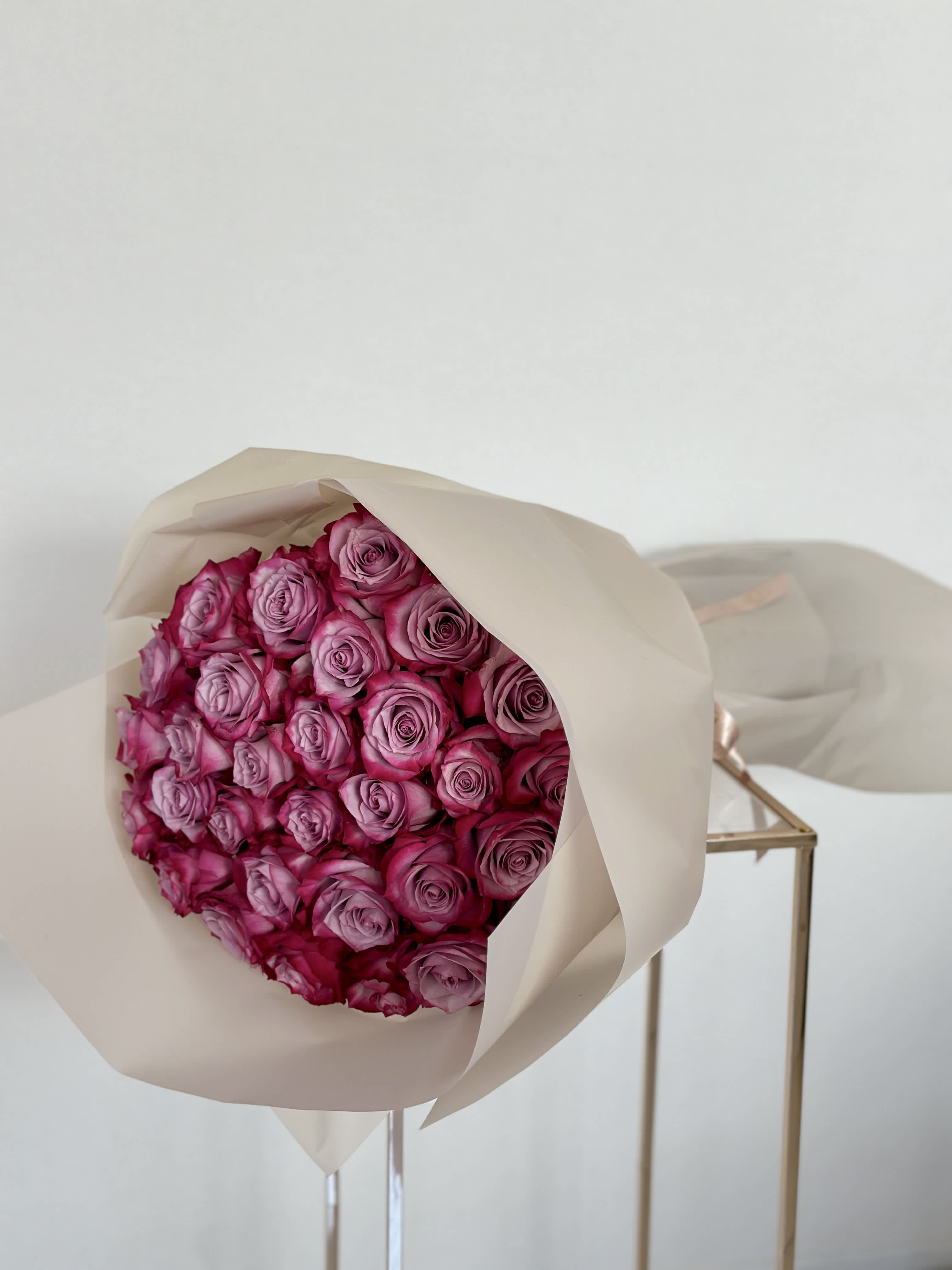 Purple Rose Bouquet - A captivating bouquet adorned with elegant purple roses. A purple rose bouquet is a symphony of beauty, weaving together shades of lavender, violet, and amethyst to create a mesmerizing display that captivates the imagination.   