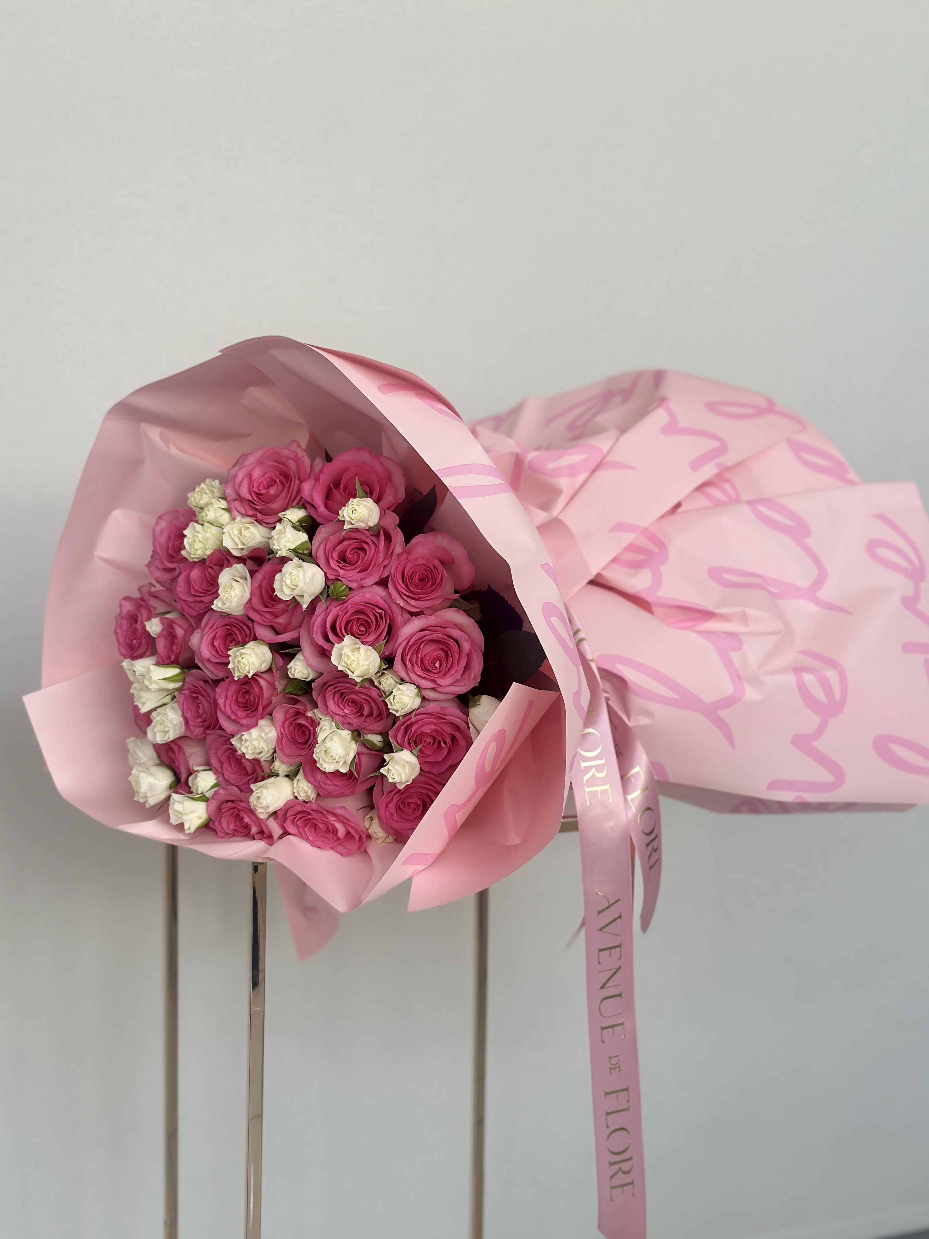 Love Notes Pink Rose Bouquet - This beautiful bouquet of pink roses and white spray roses is a lovely, fresh arrangement that’s perfect for any occasion. Whether you’re gifting it or keeping it for yourself, it’s sure to brighten up any room with its sweet and charming vibe.