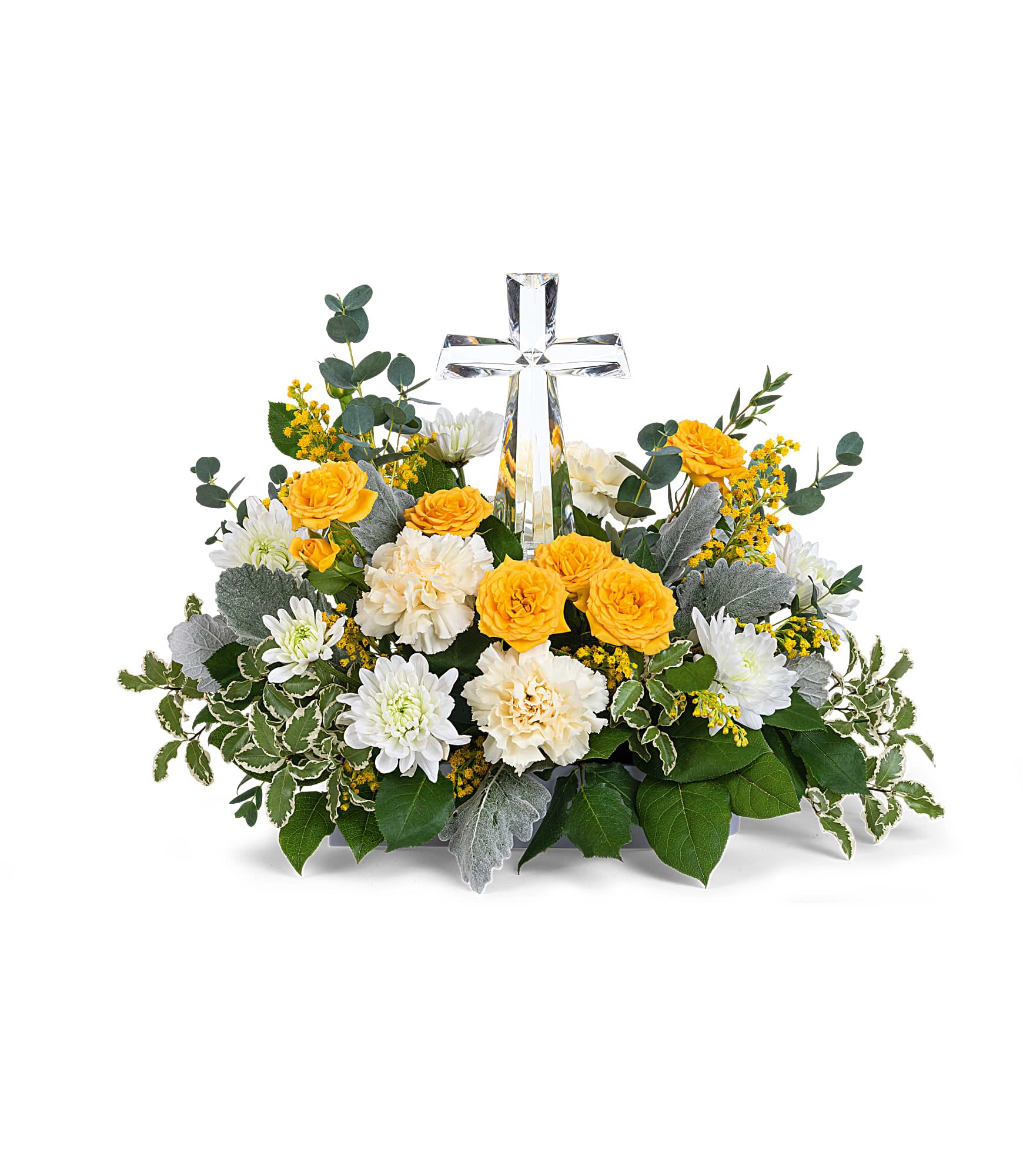 Be The Light Bouquet - Encircling a beautiful crystal cross keepsake, this sunny bouquet of roses and mums is a message of joy and hope.  This hopeful arrangement includes yellow spray roses, light yellow carnations, white cushion spray chrysanthemums, yellow solidago, parvifolia eucalyptus, pitta negra, dusty miller and lemon leaf. Delivered with Teleflora's Small Crystal Cross. Approximately 18&quot; W x 12 1/2&quot; H 