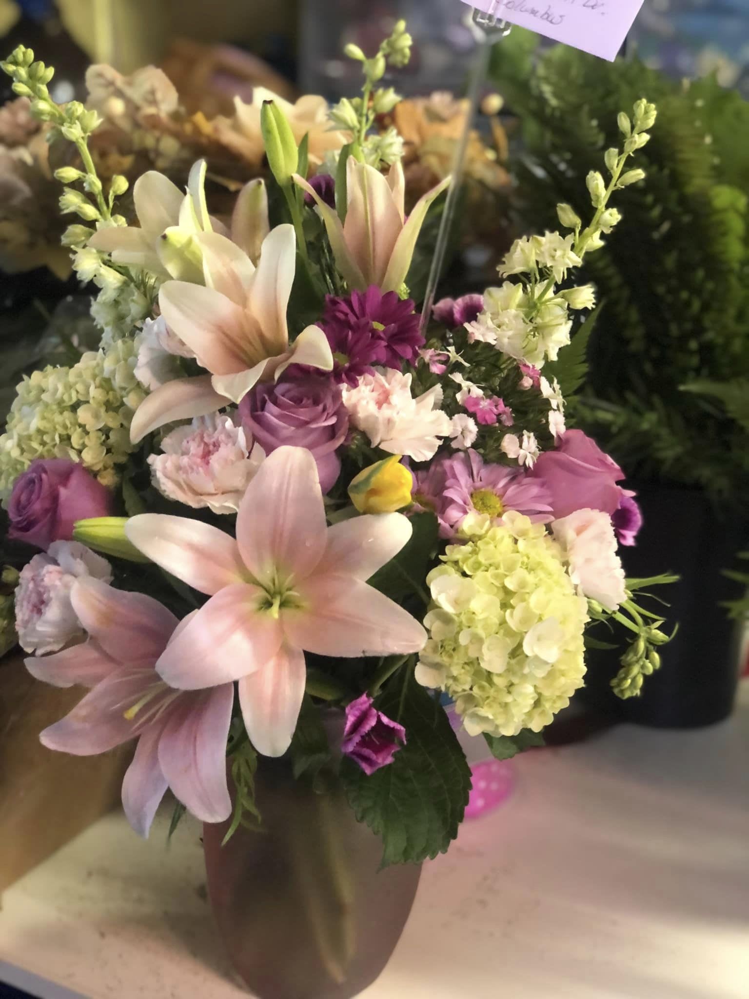 Who's Your Favorite Now? Who's Your Favorite Now? - No question who's the favorite child is now, when this beautiful bouquet is hand delivered to the one you call Mom! A mix of blooms will create the perfect look for her to enjoy her special day. *ARRANGEMENT IS ONE-SIDED*