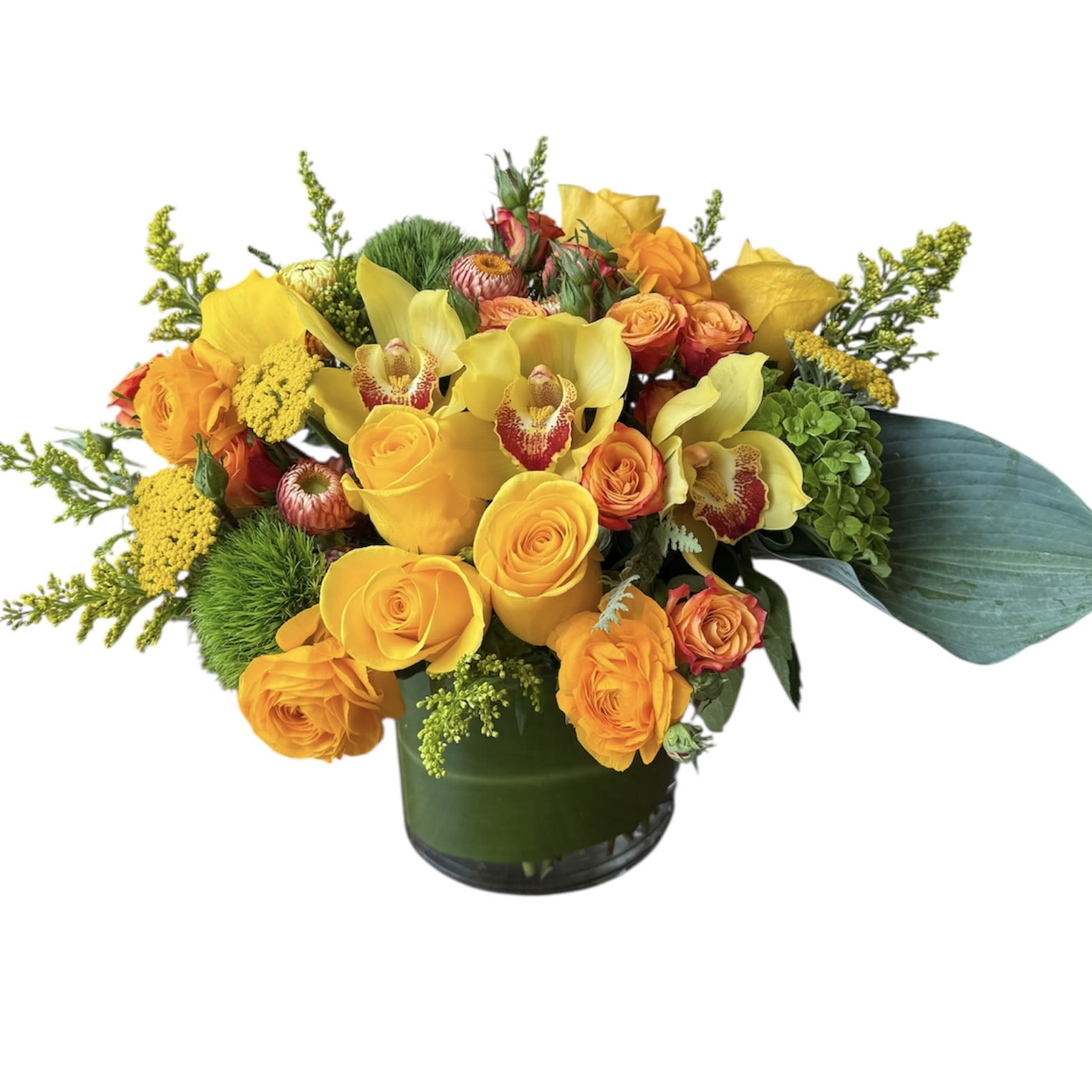 Citrus Summer Citrus Summer - Yellow roses, yellow orchids, orange spray roses, yellow ranunculus, dianthus, green hydrangea and more designed in a glass vase as shown in photo. This arrangement is large in size.