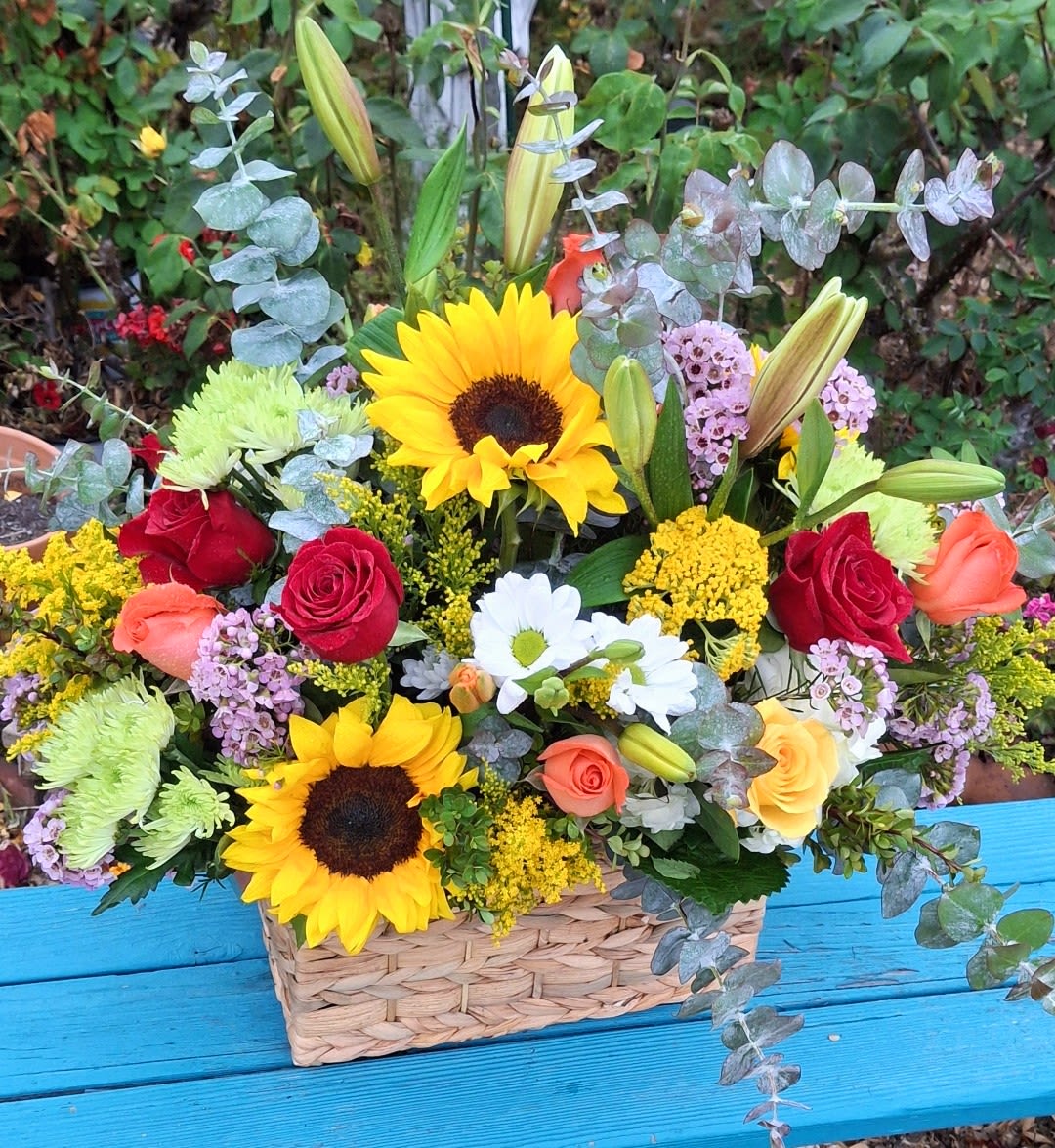 Natural delight - A Rustic box filled with bright, seasonal &amp; cheerful blooms. This well thought out floral mix will leave an everlasting impression. 