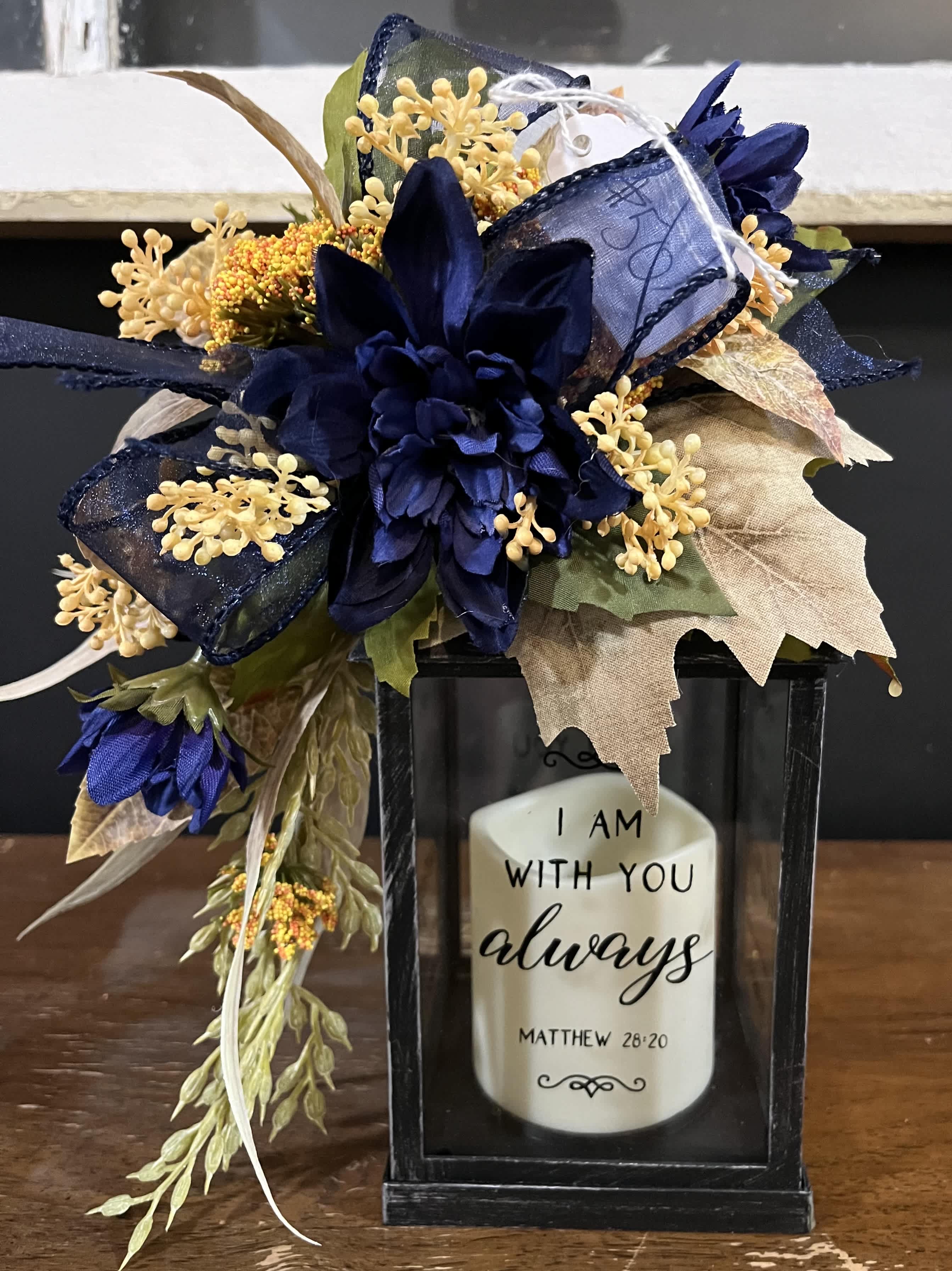 10 in Black lantern with seasonal silk - 10 in metal lantern “I am with you always” Candle and batteries included Silk will reflect current season 