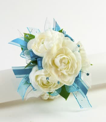 Movie Star Wrist Corsage  - Ranunculus is a timeless flower, that make a beautiful and sturdy wrist corsage. Available in a variety of colors. Price is for wrist corsage only. Please note the dress and jewelry color in special instructions. Thank you.