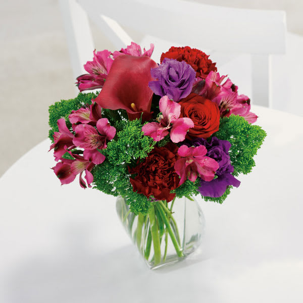 You Did It! You Did It! - Every wonderful accomplishment deserves this wonderous acknowledgement, featuring an elegant calla lily kissed by roses, alstroemeria, carnations and trachelium. - Beverly Hills Florist