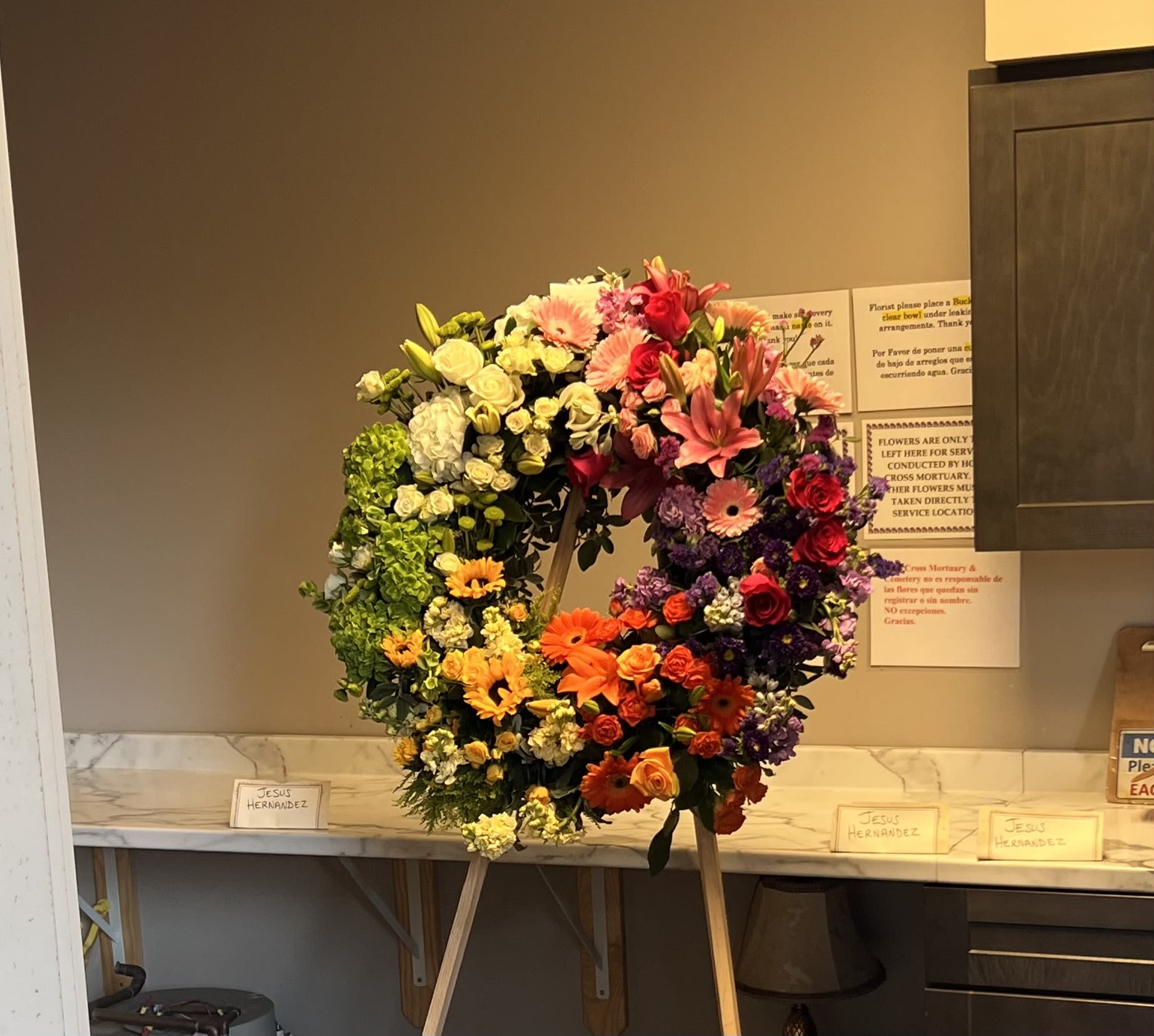FOREST HILLS FUNERAL WREATH - ON SALE WAS  $359 - ABSOLUTELY STUNNING- FIVE STAR FUNERAL WREATH. A BEAUTIFUL DESIGN OF STARGAZERS, ROSES, BELLS OF IRELAND AND MORE.