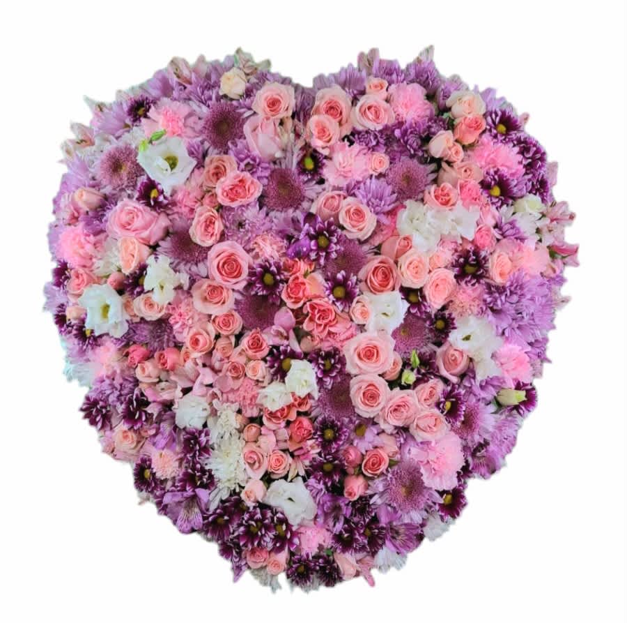 Sweetest of Hearts Sweetest of Hearts - Solid heart standing spray in shades of pink and a touch of white and lavendar.