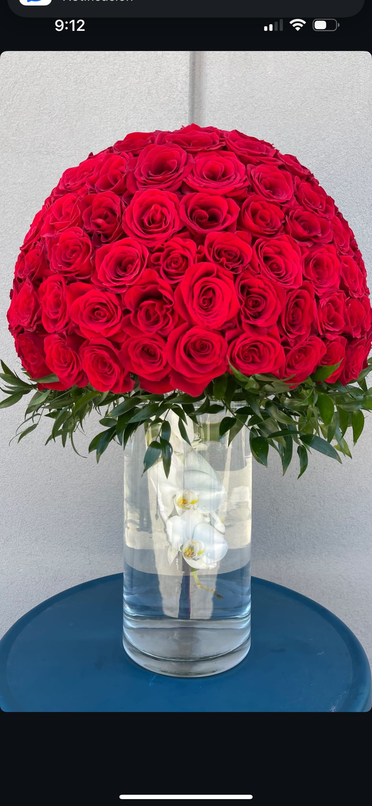 Lady in red bouquet ( tall glass floral arrangement) Lady in red bouquet ( tall glass floral arrangement) - Elegant and sophisticated floral arrangement of red roses at 360 degrees round and fresh eucalyptus, presented on high glass base with detail of white orchid dipped to give a delicate and unique touch, available every day.