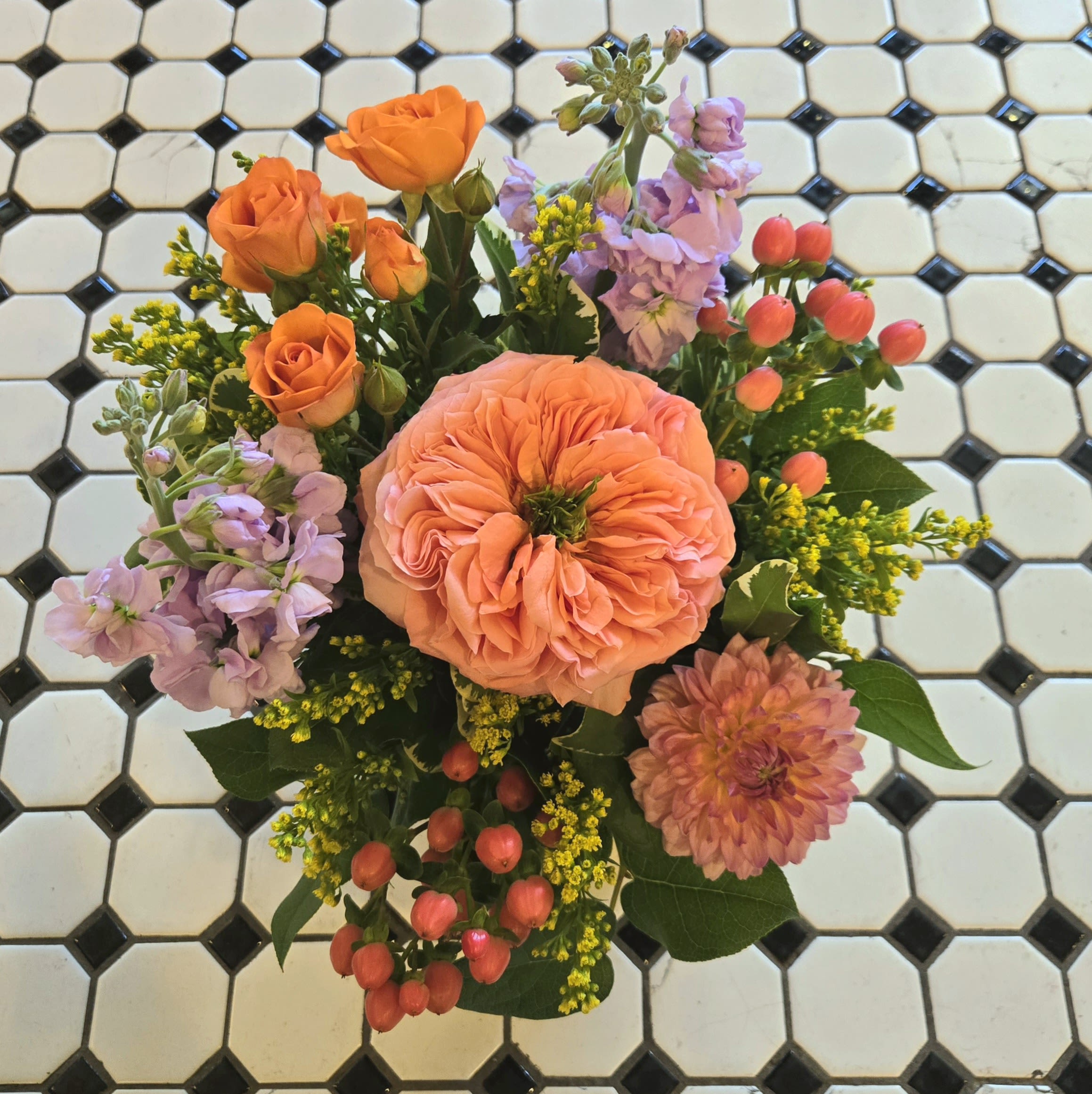 Pearlescence - Pearlescence is a captivating arrangement designed in the colors of peach, pink, orange and purple.  Featuring a unique garden rose and locally grown dahlias from our own &quot;Secret Garden&quot;. This stunning, compact arrangement is perfect to brighten any home or office space.  