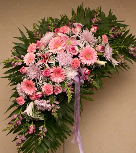 Pink & Lavender Mix Crescent Spray Pink & Lavender Mix Crescent Spray - Let these flowers express your support. Send a crescent spray of mixed pink and lavender garden flowers that include roses, mums, carnations and more. Approximately 30" long x 20" wide in greenery and flowers During the order process, you can indicate where to send the flowers. Order by 10am to ensure delivery for 2pm showings at wakes.