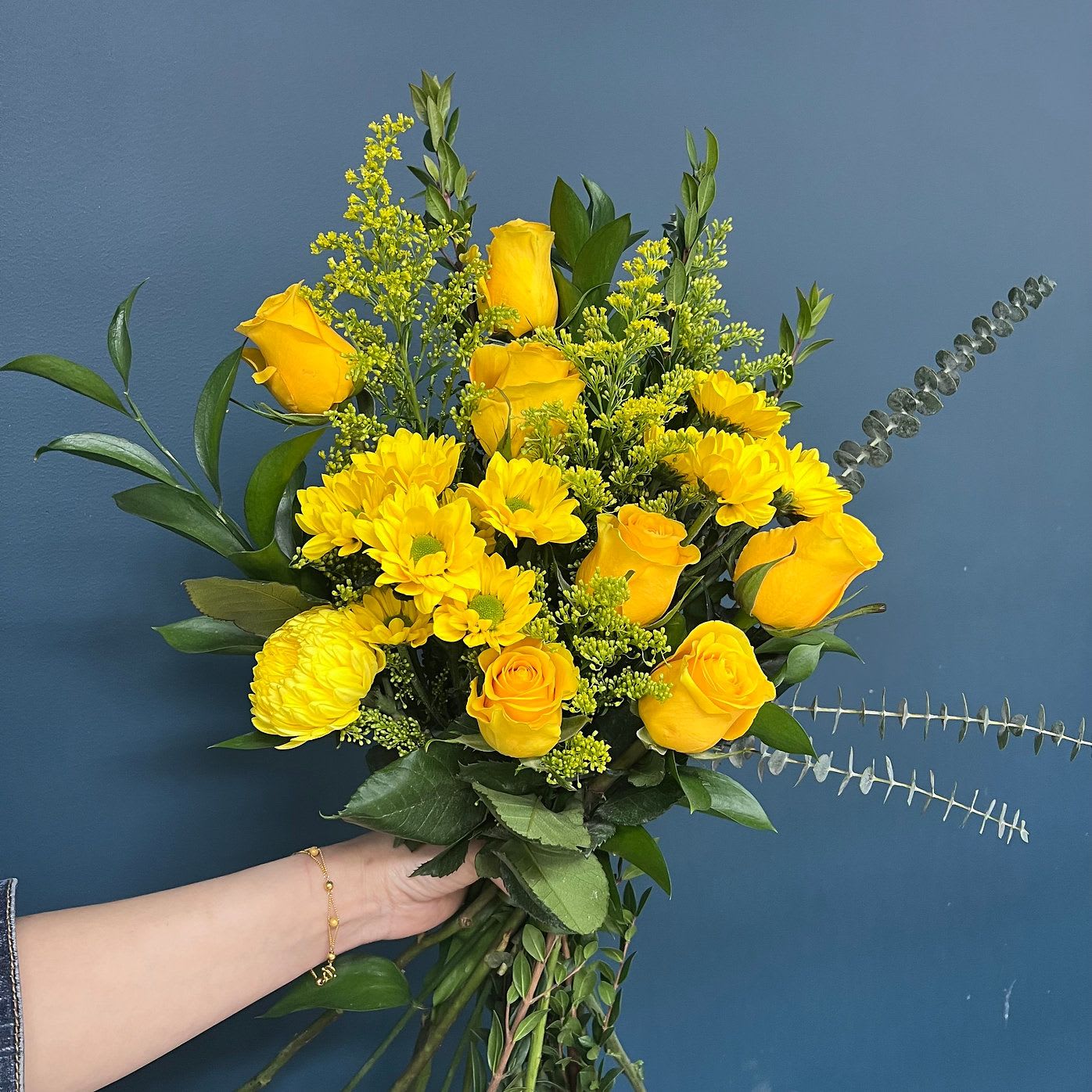 Summer Holiday - A joyful gathering of bright yellow florals and breezy greens, “Summer Holiday” brings the energy of summer fields and open skies. Raw, radiant, and hand-tied for maximum impact, this bouquet is perfect for housewarmings, joyful offerings, or anyone who deserves a little light.  For big hugs, good news, and golden-hour gratitude.