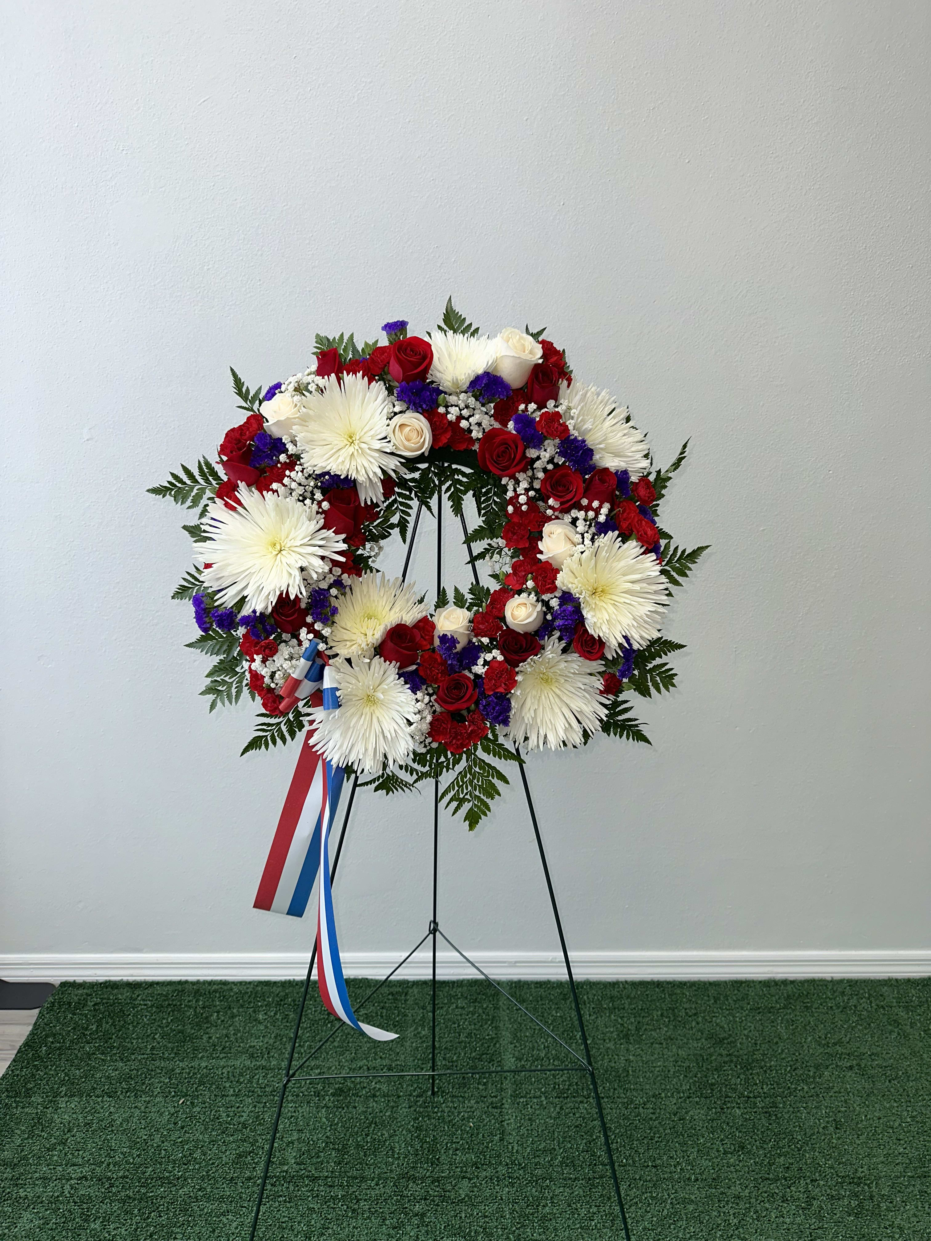 Comfort wreath Comfort wreath - White, blue and red wreath Flowers and color substitution might apply