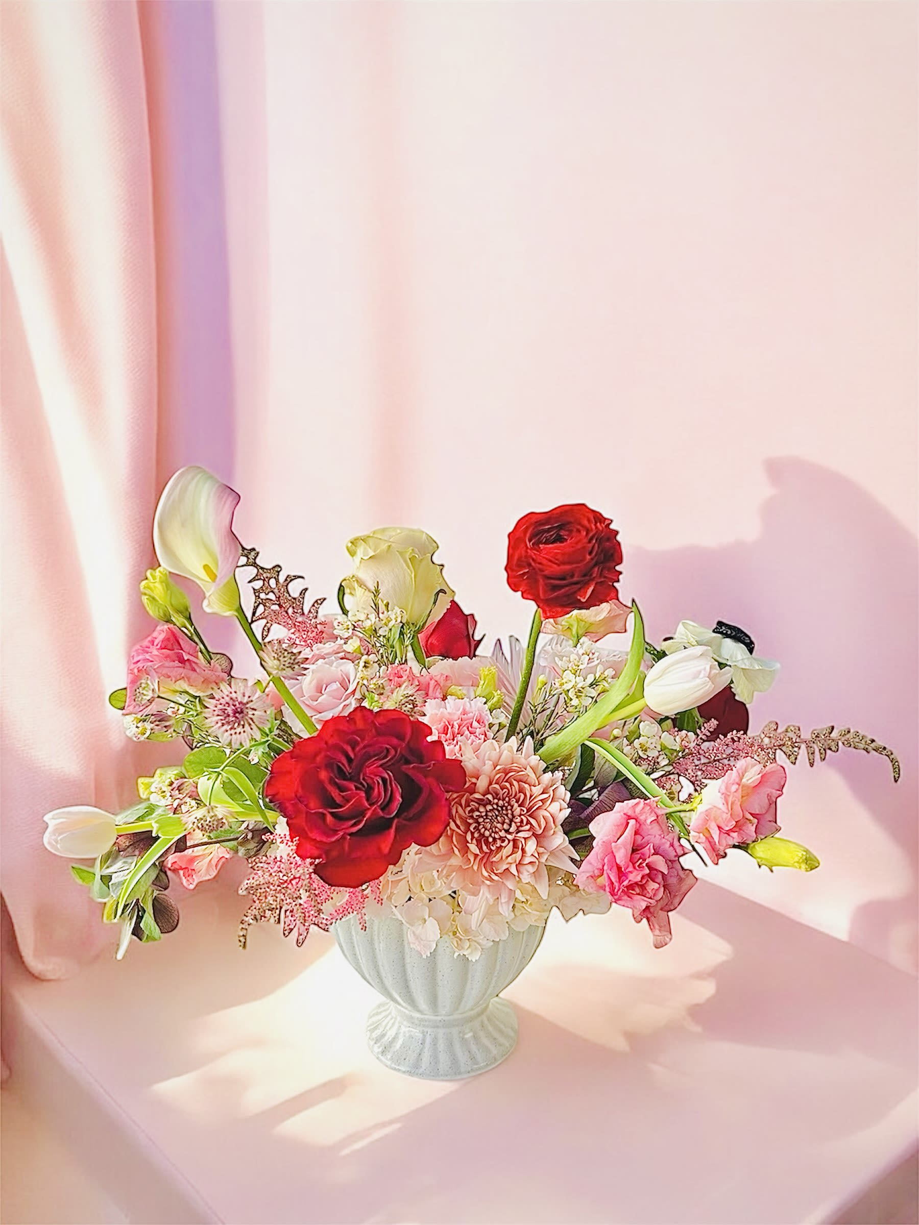 Endearing  - Please keep in kind that no arrangement can be made identical to the photos shown (as some flowers are seasonal). Therefore, we will substitute them accordingly with in-season flowers instead. We will do our absolute best to arrange the flowers as similar as possible with the photos shown!   For Bouquets, we DO NOT include vases unless you add one.  For Vased Flowers, we include vases.   Right now, you can expect spring blooms sourced from local farms.   We use small ordinary 4in by 3in cards. If you want to send flowers with a special messaging card, please choose one from add-ons!  Delivery: our standard delivery time window is between 3:00pm and 5:00pm.   If you have any questions regarding the order, please feel free to contact us!   Email: agapeflower.studio25@gmail.com     The photo serves as a style reference. Flowers may vary slightly but style and color will be maintained. The vase arrangement is endearing and feminine; includes some elegant blooms like calla lily, lisianthus, hellebore, and ranunculus. 