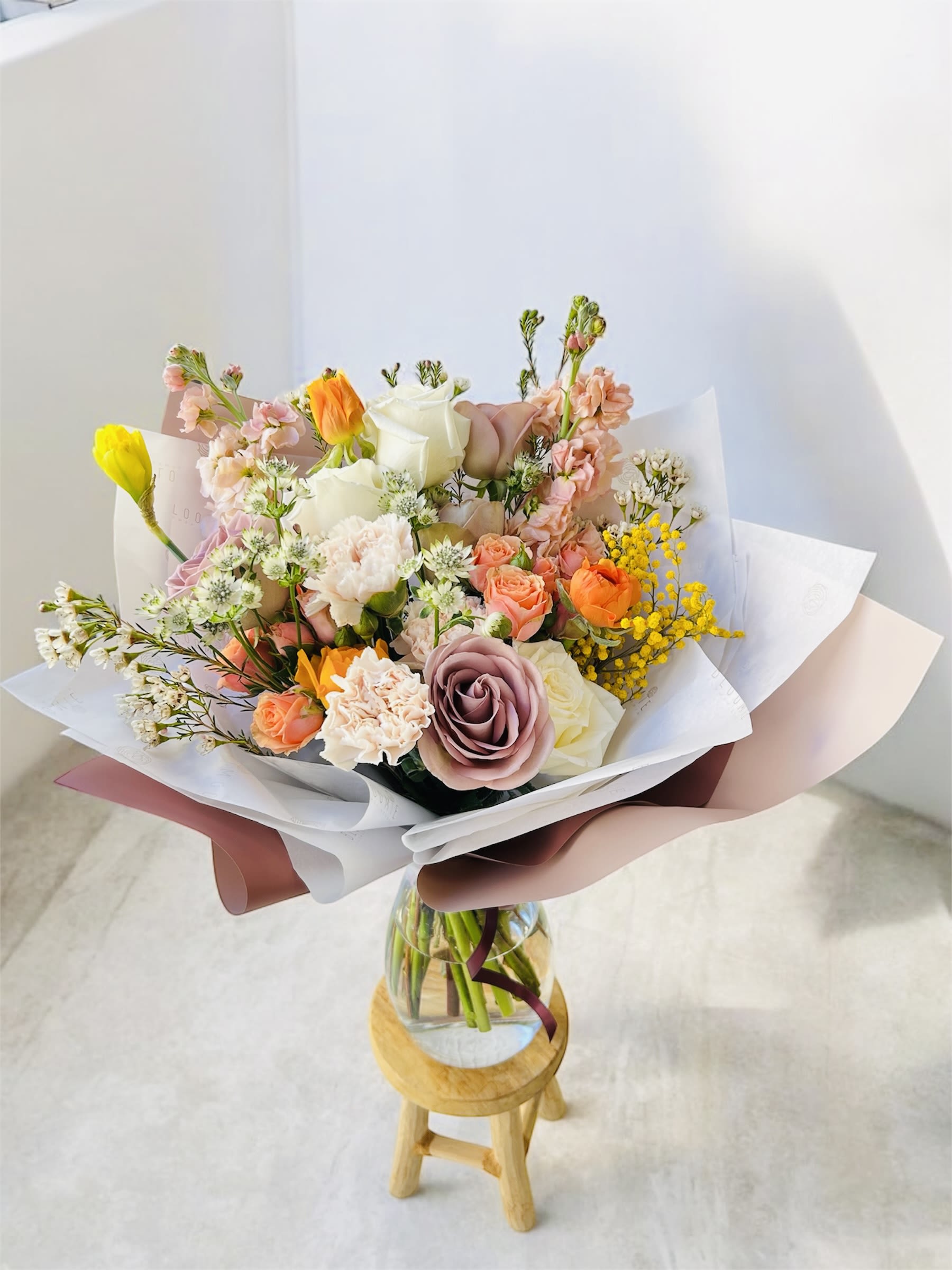 Royalty  - Please keep in kind that no arrangement can be made identical to the photos shown (as some flowers are seasonal). Therefore, we will substitute them accordingly with in-season flowers instead. We will do our absolute best to arrange the flowers as similar as possible with the photos shown!   For Bouquets, we DO NOT include vases unless you add one.  For Vased Flowers, we include vases.   Right now, you can expect spring blooms sourced from local farms.   We use small ordinary 4in by 3in cards. If you want to send flowers with a special messaging card, please choose one from add-ons!  Delivery: our standard delivery time window is between 3:00pm and 5:00pm.   If you have any questions regarding the order, please feel free to contact us!   Email: agapeflower.studio25@gmail.com     Vase is not included. Lavender rose, peach stocks, light orange spray roses, and soft ivory. Royalty is the sweetest gathering of spring and summer blooms! 