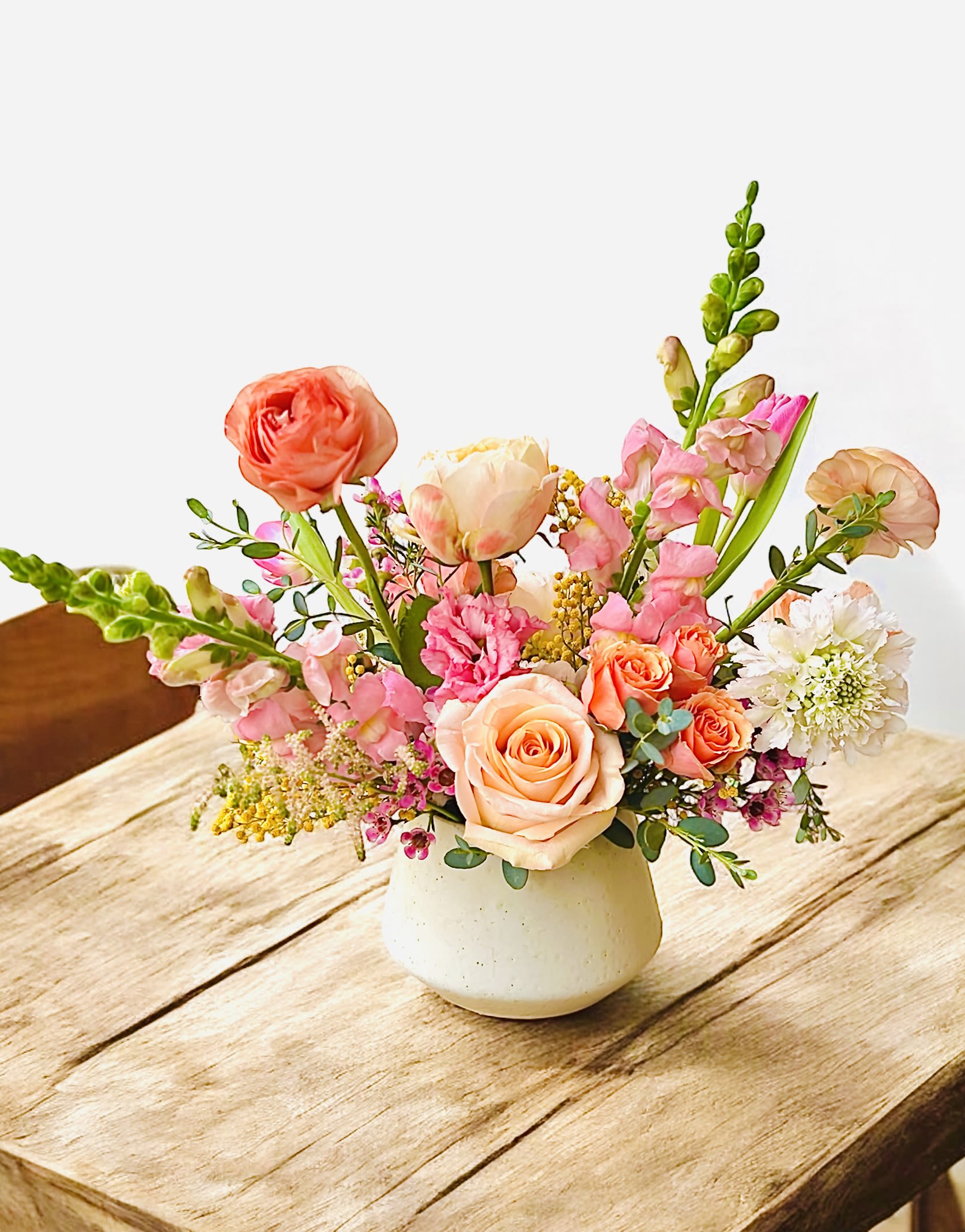 Sweetie - The arrangement is petite and cute. The vase might be different from the picture but the colors will be similar. It is perfect for your dining or living room tables! 
