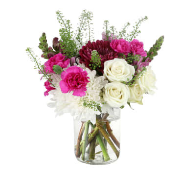 Maisonette  - A designers choice of flowers wildly arranged and a mason jar wrapped around with a row. This random mix of flowers will be guaranteed to bring a smile. Keep in mind that this arrangement is completely at random, though if you have a preference of colors or flowers, please let us know! :)