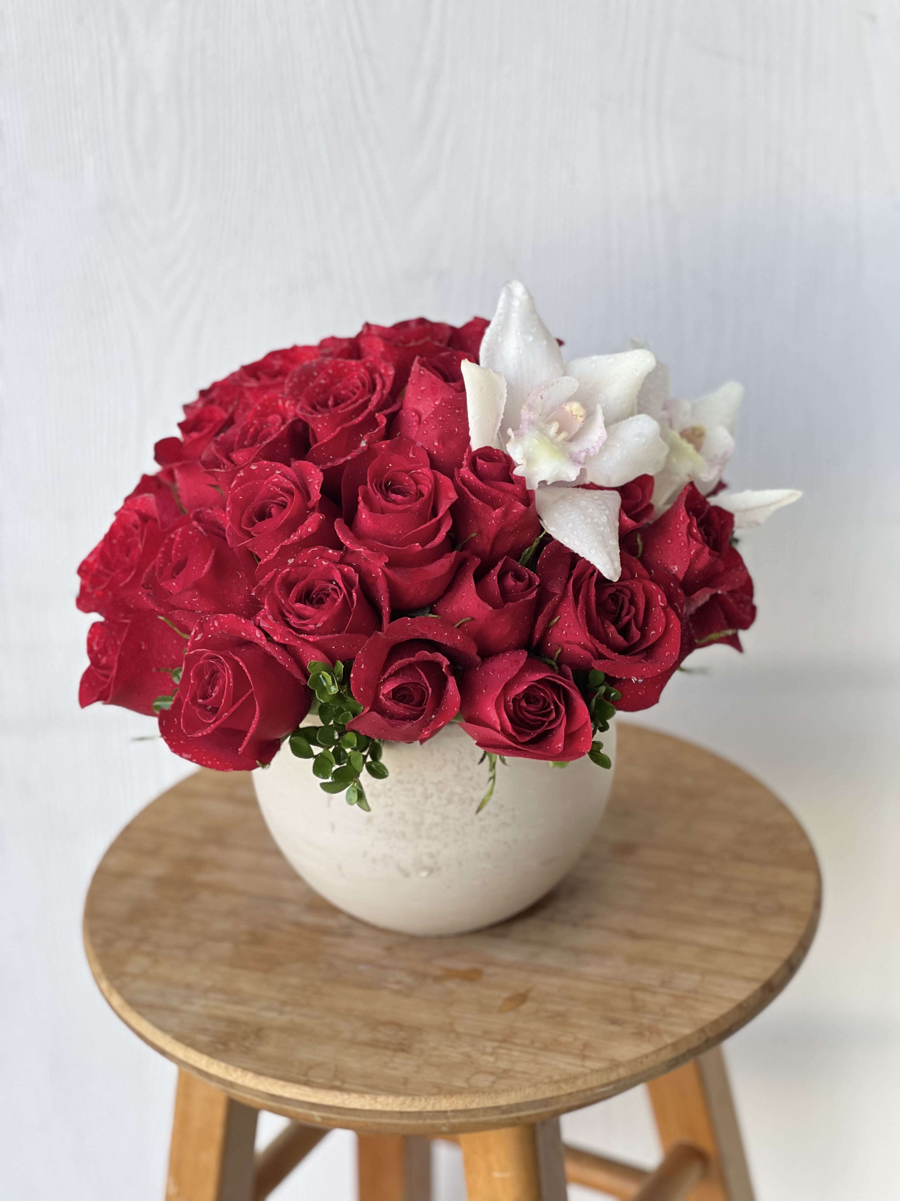 EC45 - Romance Bouquet EC45 - Romance Bouquet - Romance Boq – Red Rose and Orchid Arrangement | Flower Delivery in Tustin Turn up the romance with our luxurious Romance Boq – a lush arrangement of deep red roses paired with stunning white cymbidium orchids, artfully arranged in an elegant white ceramic vase. Designed to capture hearts and elevate any moment, this striking floral display speaks the language of love in the most sophisticated way. Perfect for anniversaries, romantic surprises, or Valentine’s Day, the Romance Boq blends classic beauty with modern elegance. The vibrant red roses symbolize deep affection and passion, while the exotic white orchids add a touch of purity and refinement. Why Choose the Romance Boq: Premium red roses and cymbidium orchids,Arranged in a modern ceramic vase with lush greens,A bold, romantic design for love-filled occasions, Perfect for anniversaries, Valentine's Day, or “just because”. Same-day flower delivery available in Tustin, Irivne ,Newport Beach, Costa Mesa, and nearby Orange County cities Send a message of love and beauty with Romance Boq – exclusively from Everyday Creations, your trusted local florist in Tustin, CA. Order online today for fast, hand-delivered floral service you can count on.