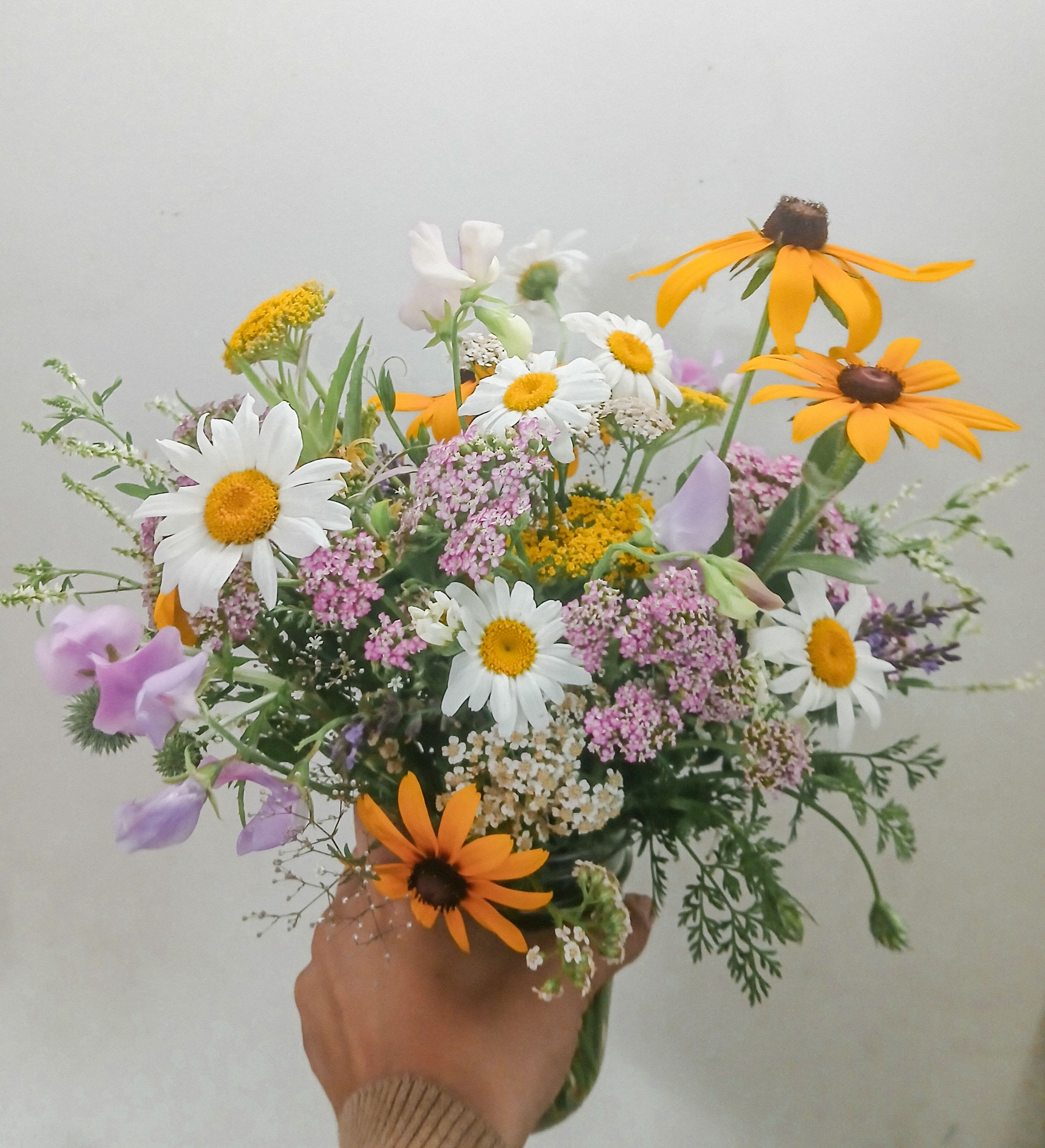 A little Sunshine in your Heart - A happy arrangement of our own locally grown flowers in happy pastel pink, lavender, yellow, white and gold. 