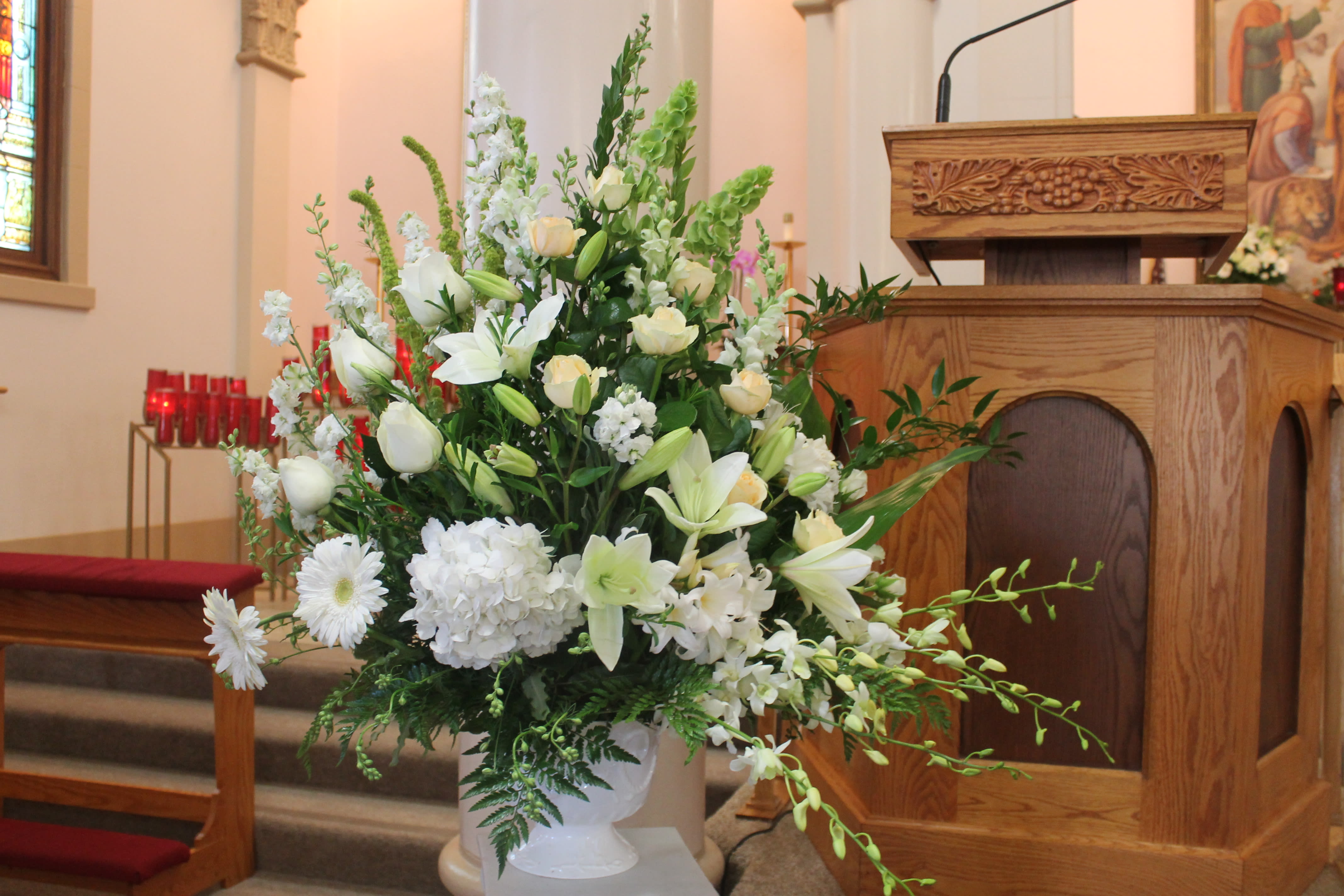 Blessed in White - This lovely basket in different white tones displays a pure and heavenly appearance for your loved one.