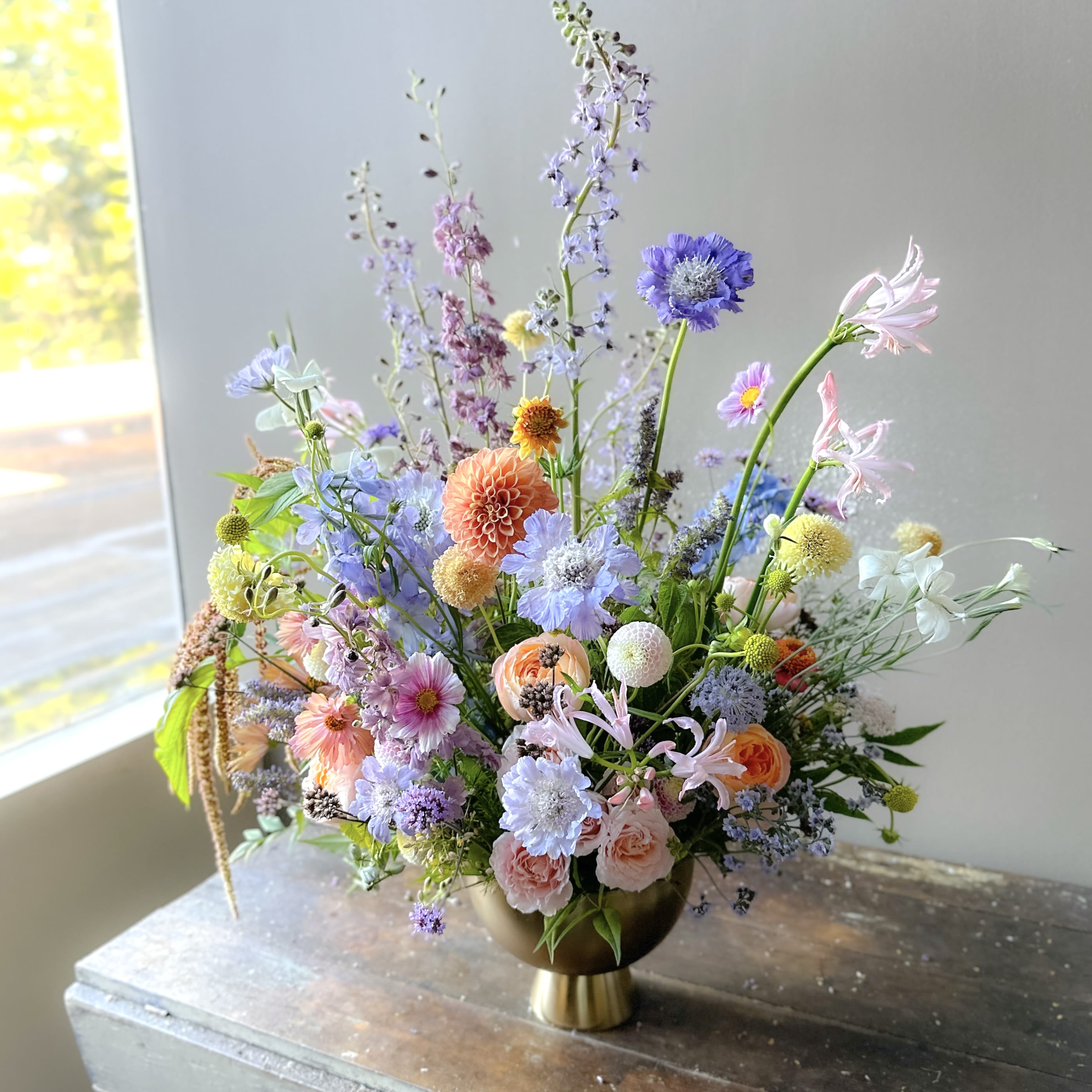 Esla (Gallery Photo) - A painting inspired bouquet in gorgeous harmony of colors! This bouquet is a masterpiece gathered straight from nature’s canvas, each bloom is hand-selected to lift the spirit and brighten any space. A truly radiant gift that brings warmth, joy, and the timeless beauty to every day.  