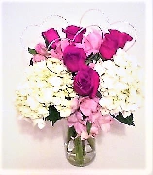 Wrapped with Love and Hot Pink Roses Wrapped with Love and Hot Pink Roses - 6 roses,white hydrangeas,and pink alstromeria in a clear vase with silver hearts for your special someone!
