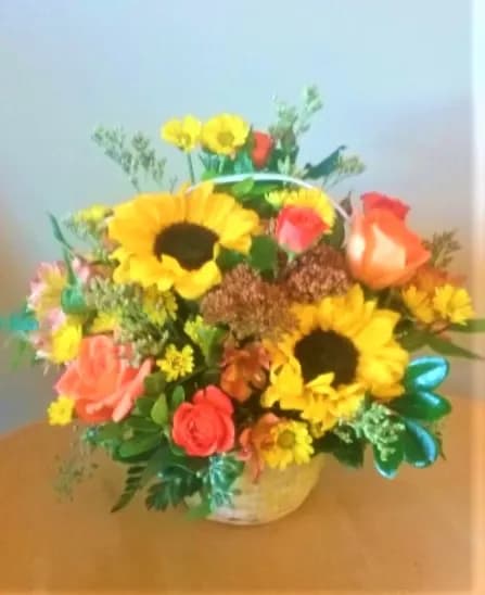 Sunshiny Day  - A basket of beautiful sunflowers,orange spray roses,bright yellow daisies and more.Just the right combination for any birthday, get well ,or just for a cheerful gift